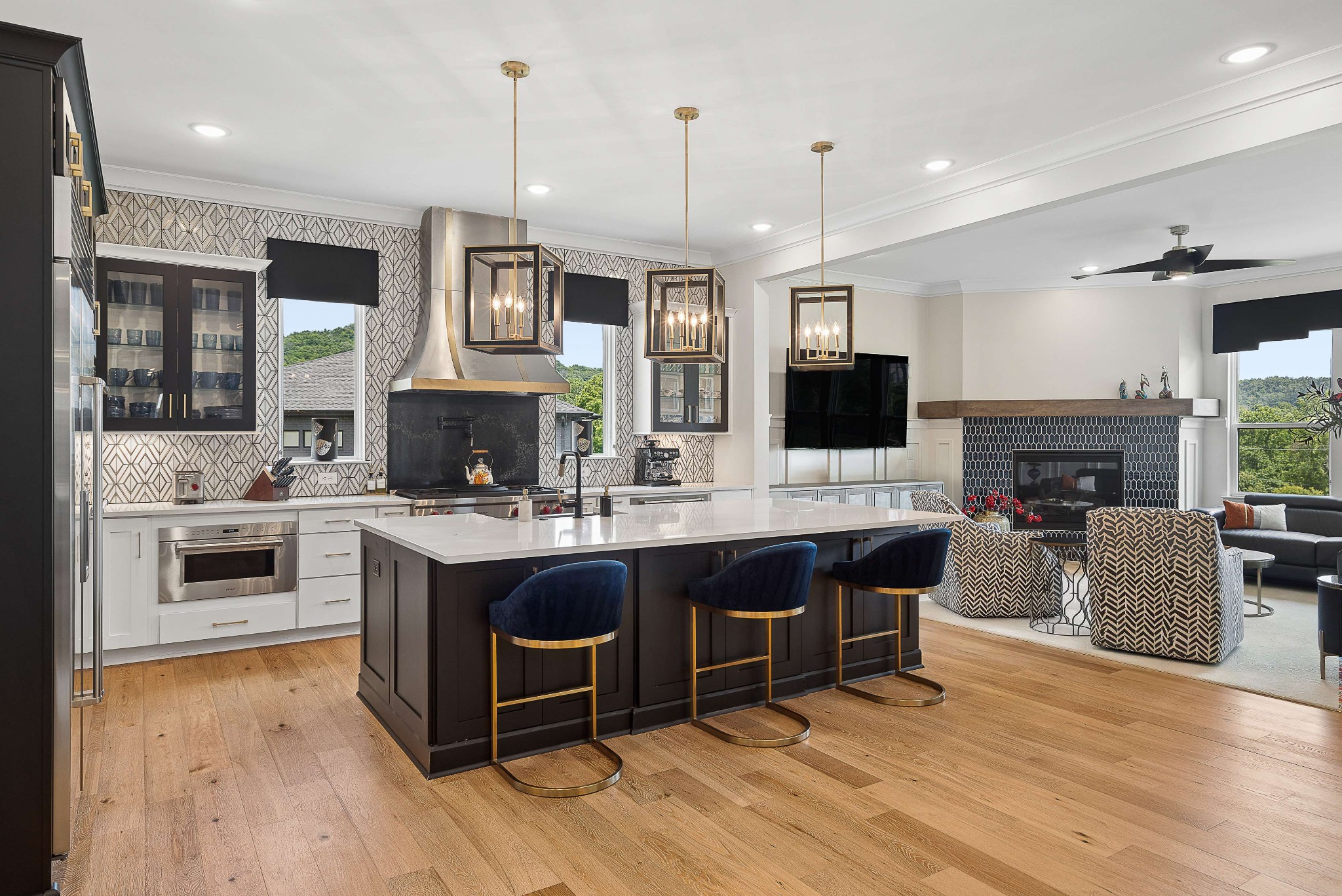 6004 Lookaway Circle Franklin, TN 37067 - Photo 19 of 71 a large kitchen with stainless steel appliances granite countertop a stove and a view of living room