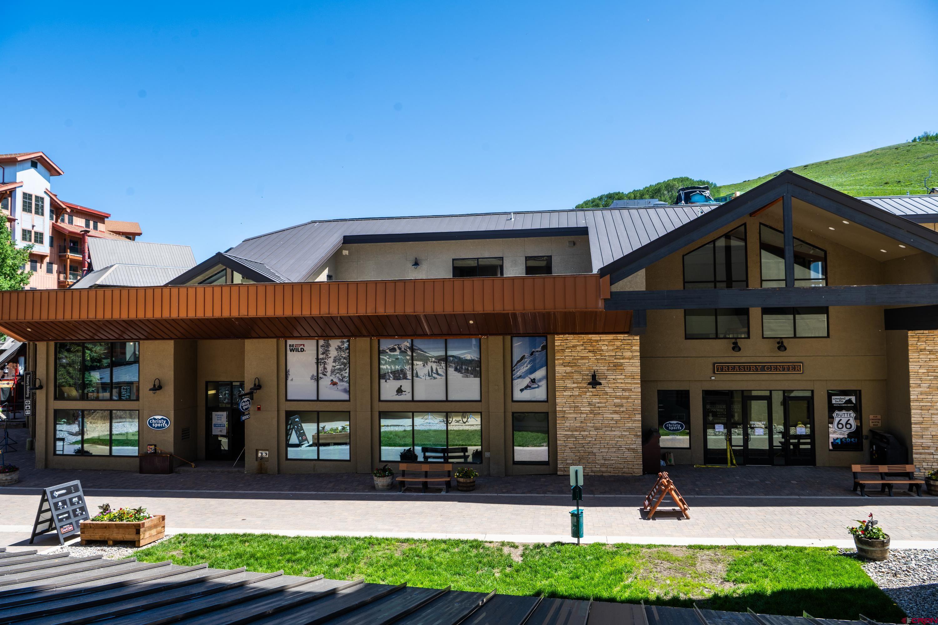 500 Gothic Road, Unit 335 Crested Butte, CO 81225 - Photo 17 of 20 a front view of a house with garden