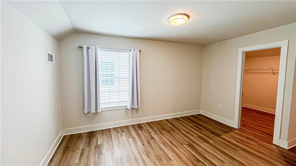 740 Eudora Welty Way Athens, GA 30607 - Photo 45 of 57 an empty room with wooden floor and windows