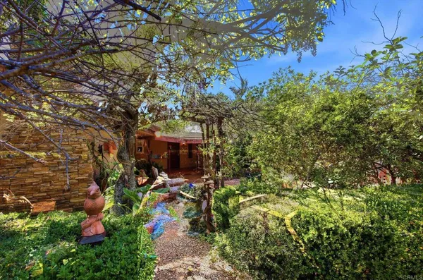 a view of a patio with table and chairs and potted plants