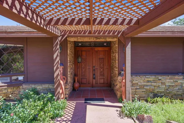 a front view of a house with a porch
