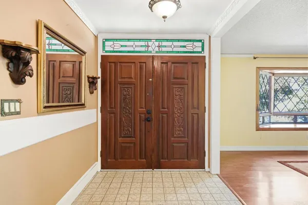 a view of a hallway with front door