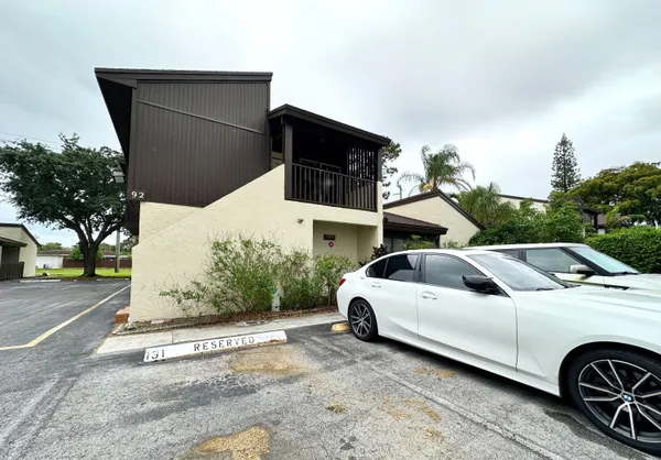 a view of a car parked in front of a house