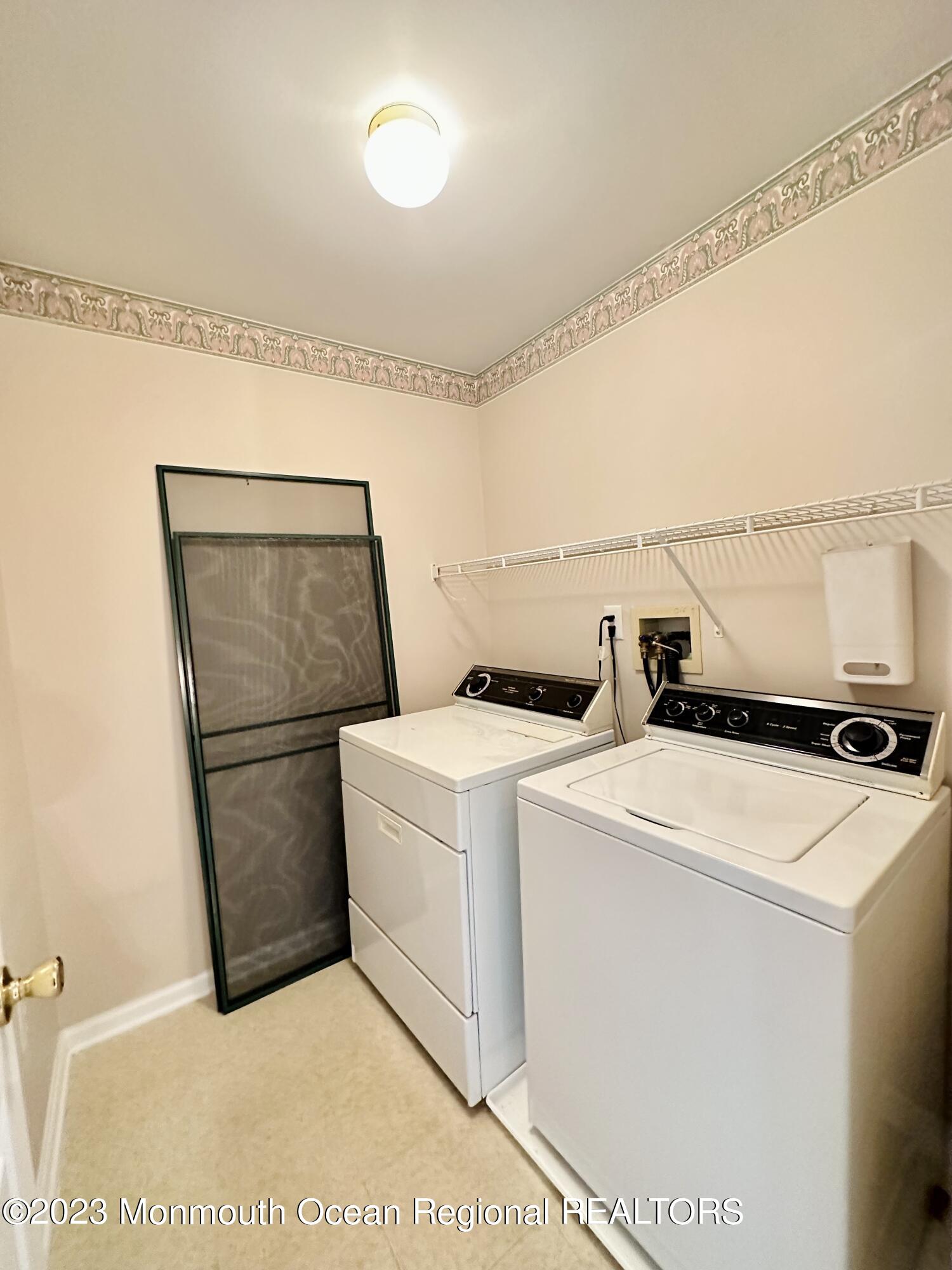 8 Alpine Road, Unit 197 Holmdel, NJ 07733 - Photo 13 of 18 a utility room with dryer and washer