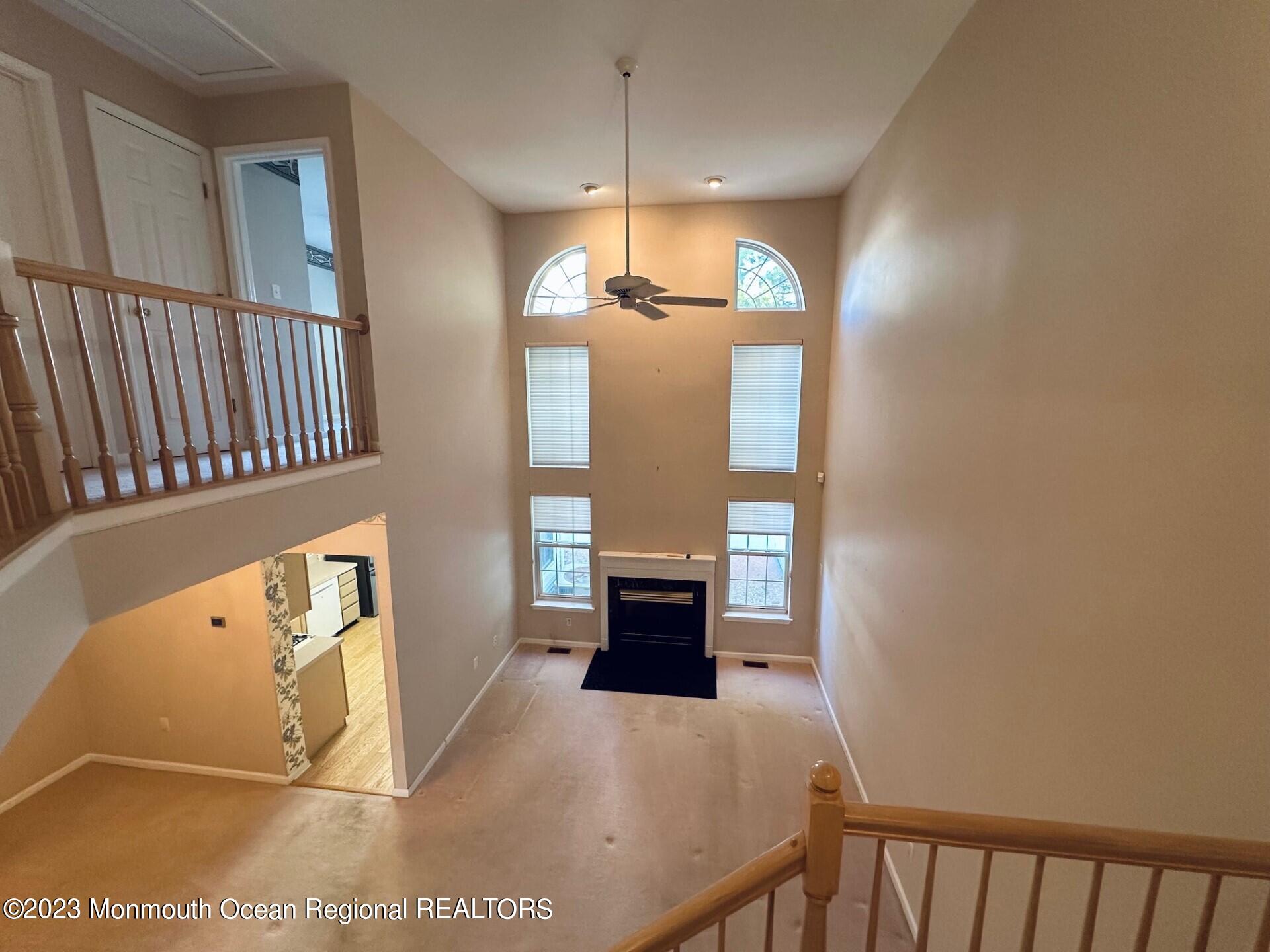 8 Alpine Road, Unit 197 Holmdel, NJ 07733 - Photo 6 of 18 a view of a hallway with windows