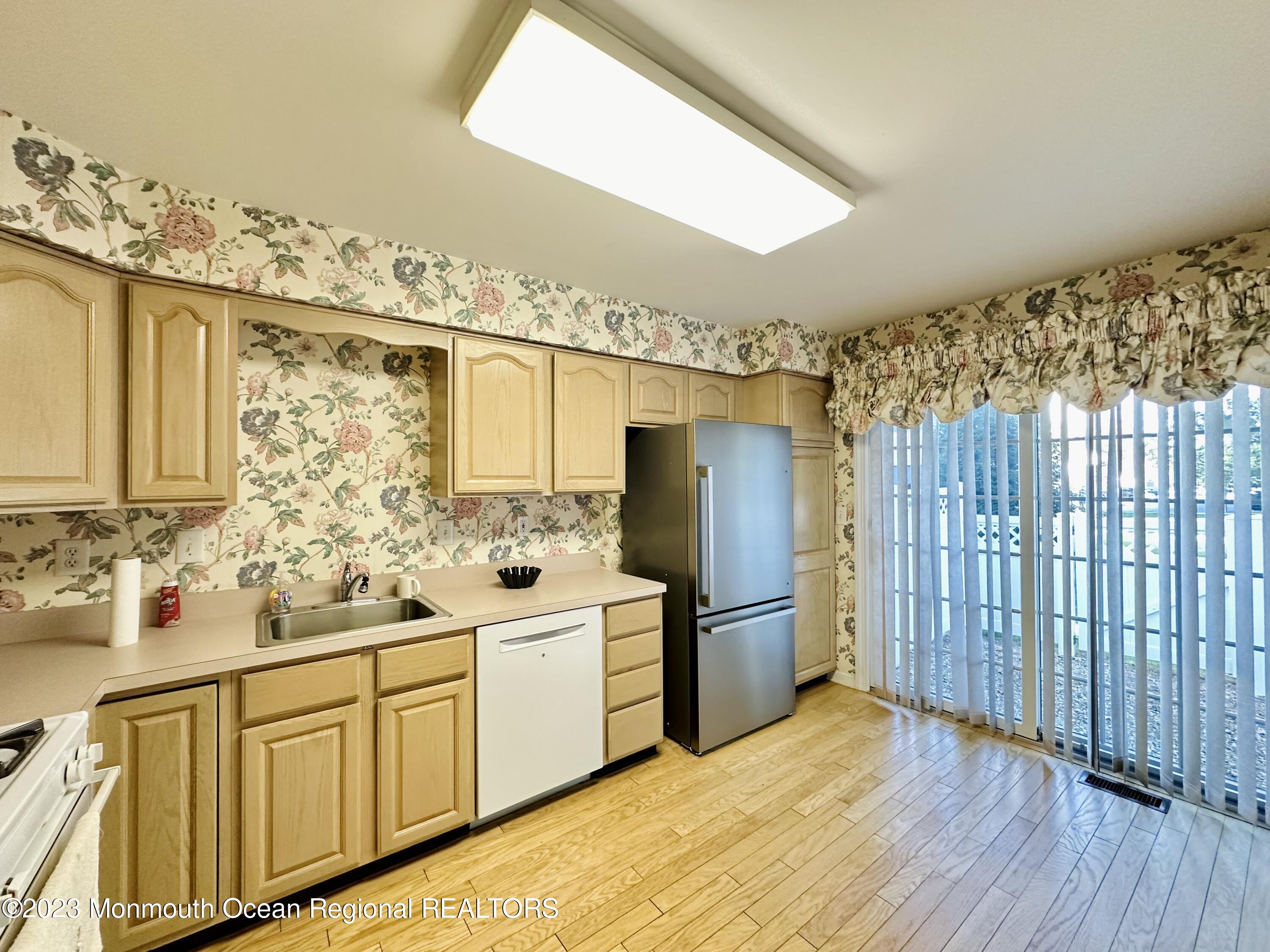 8 Alpine Road, Unit 197 Holmdel, NJ 07733 - Photo 8 of 18 a kitchen with stainless steel appliances a refrigerator and a stove