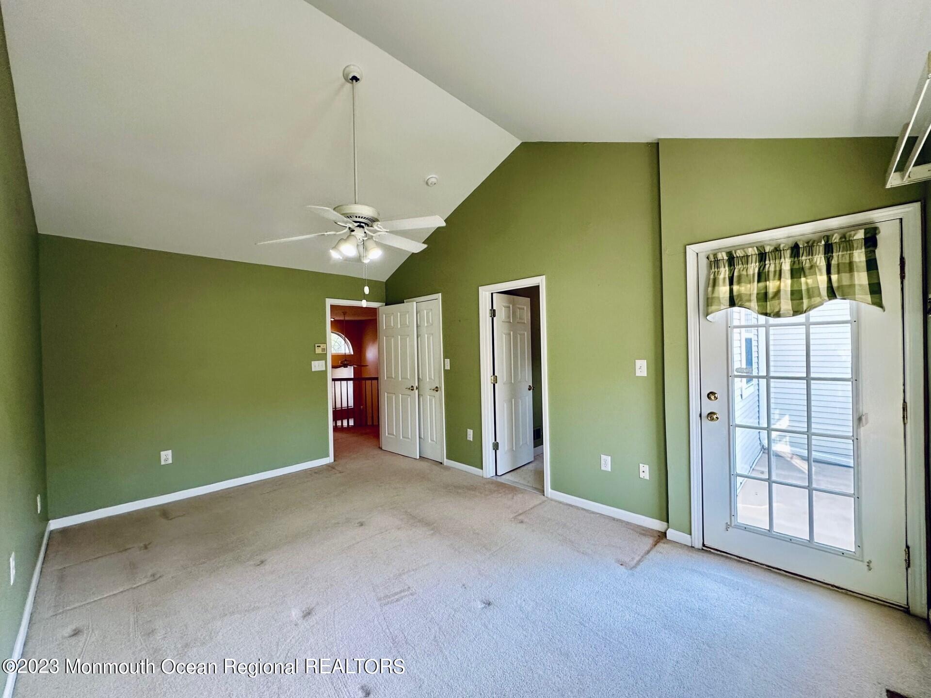 8 Alpine Road, Unit 197 Holmdel, NJ 07733 - Photo 9 of 18 a view of an empty room with window and stairs
