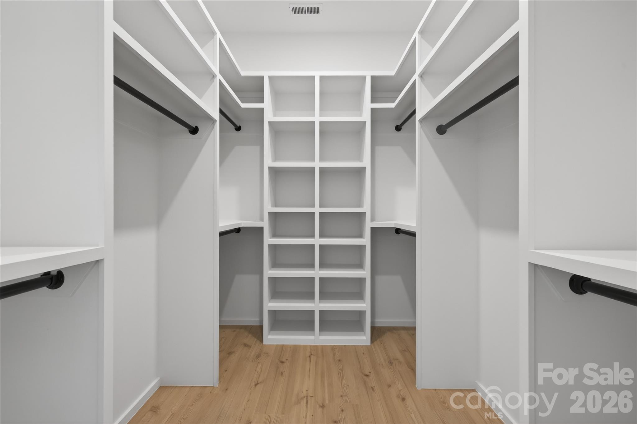 115 High Shores Road Norwood, NC 28128 - Photo 19 of 30 a view of an empty room with wooden floor and closet