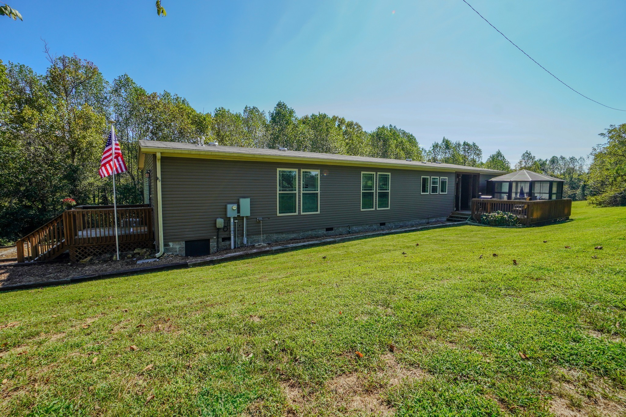 137 Hawkins Road Westmoreland, TN 37186 - Photo 15 of 71 a view of a house with a backyard and a patio