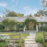 a view of a house with a swimming pool and a garden
