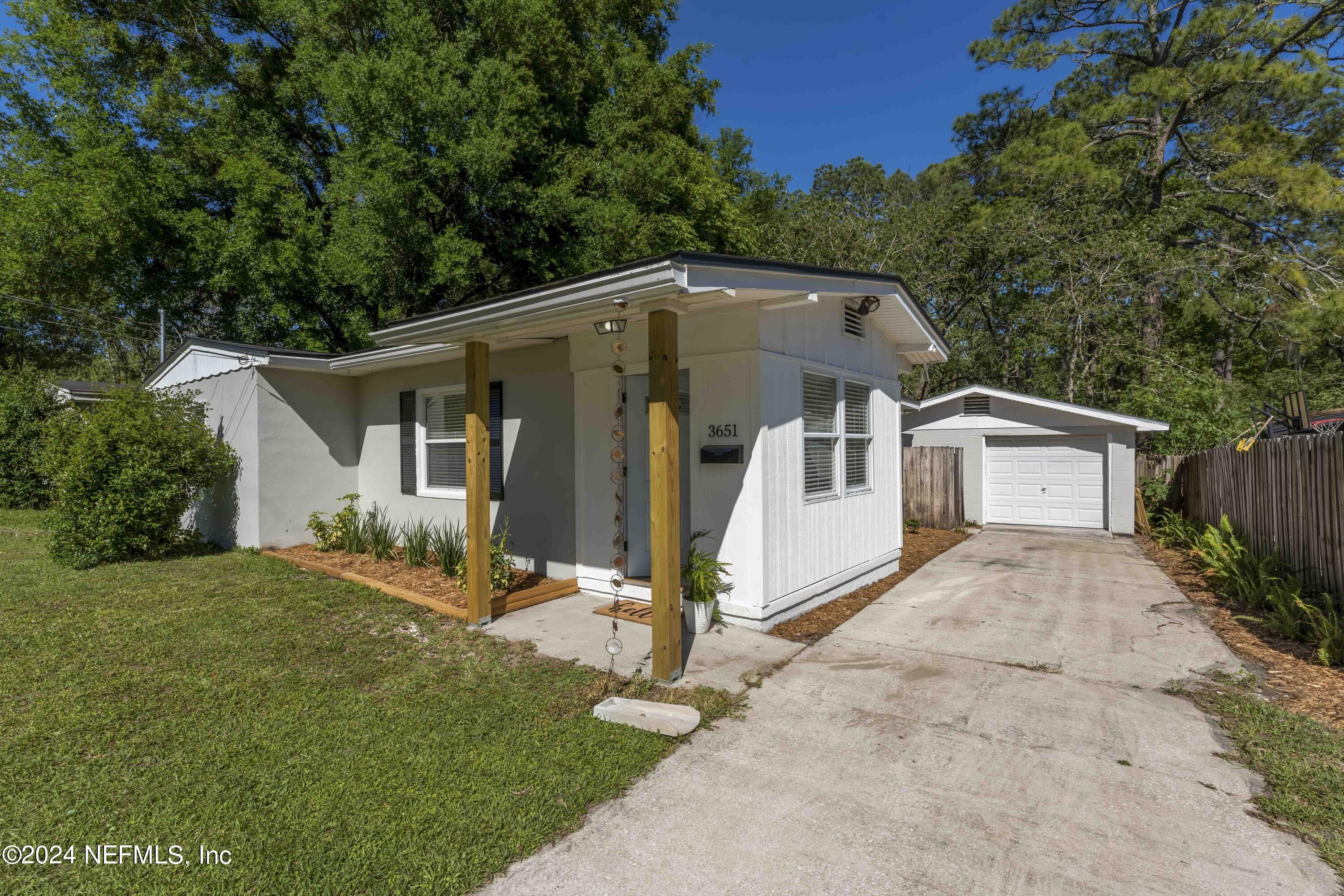 3651 Peach Drive Jacksonville, FL 32246 - Photo 2 of 25 a front view of a house with a yard