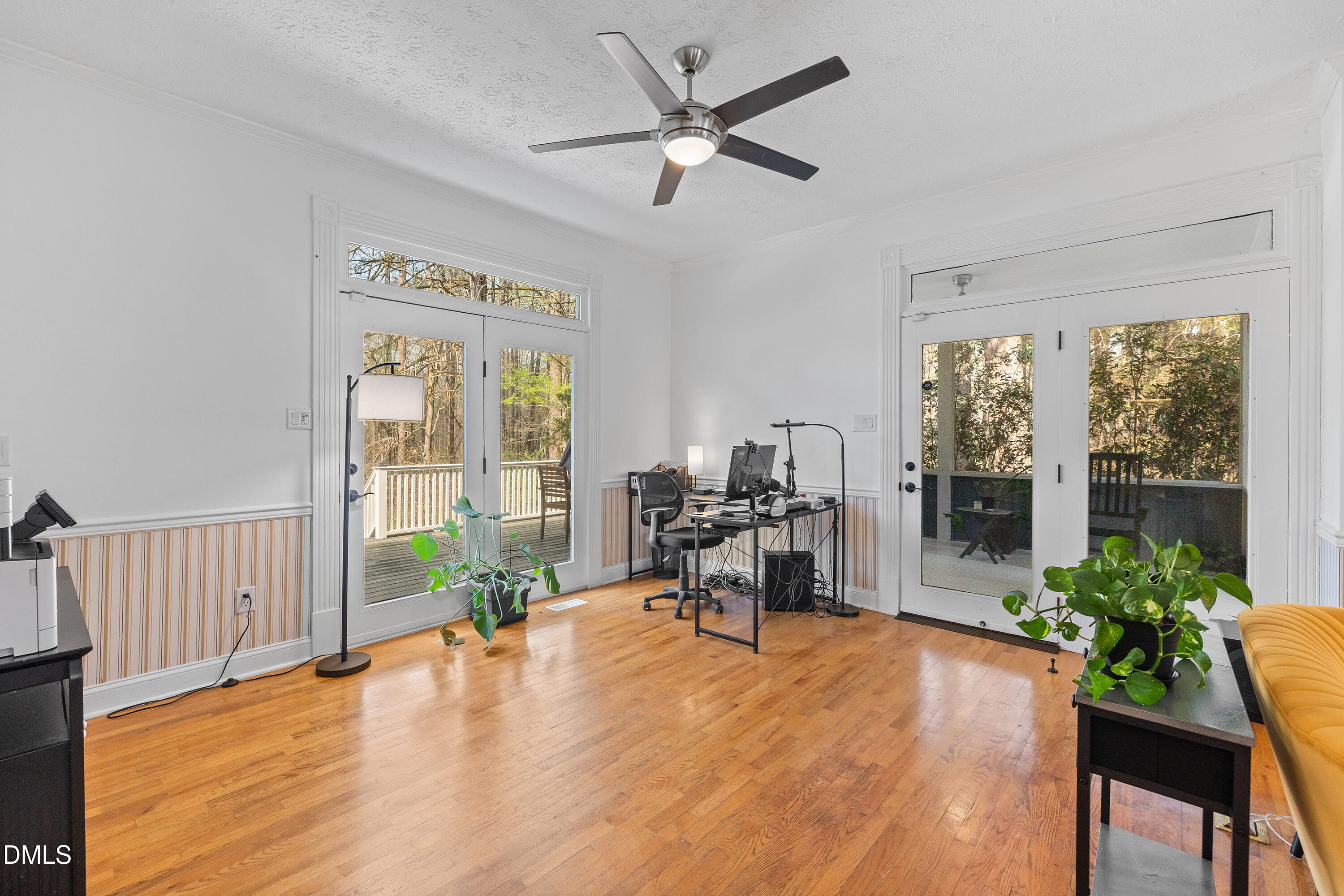 340 Andrews Store Road Pittsboro, NC 27312 - Photo 13 of 59 a living room with furniture floor to ceiling window and a potted plant