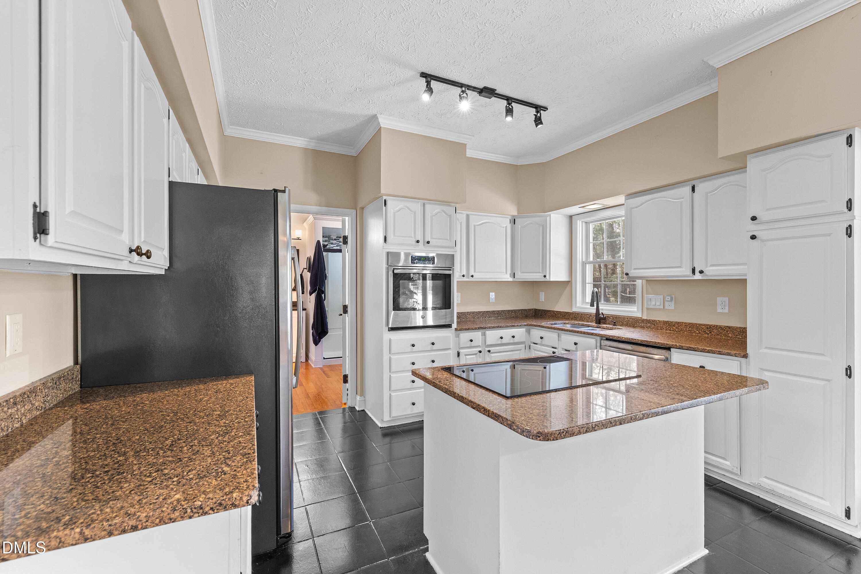 340 Andrews Store Road Pittsboro, NC 27312 - Photo 18 of 59 a kitchen with stainless steel appliances granite countertop a refrigerator and a sink