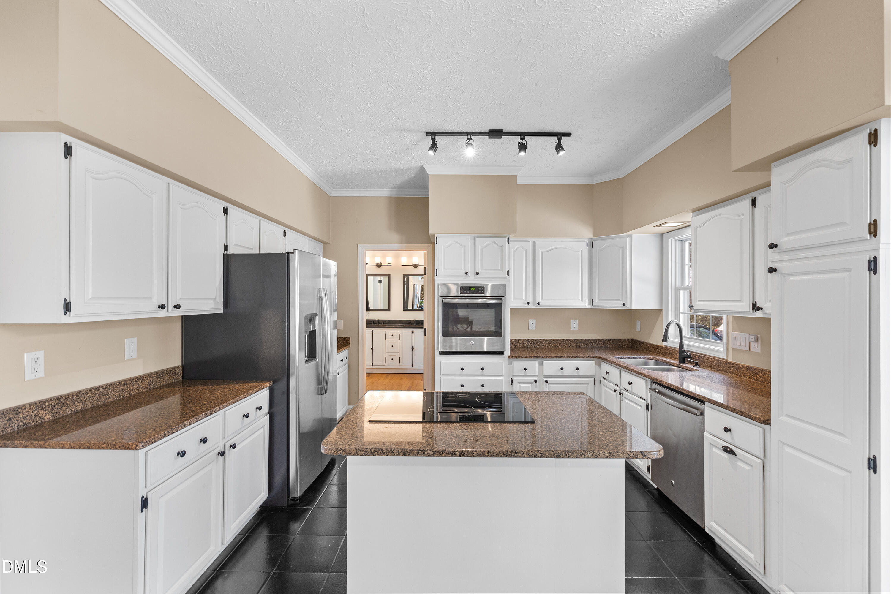 340 Andrews Store Road Pittsboro, NC 27312 - Photo 19 of 59 a kitchen with stainless steel appliances granite countertop a sink stove refrigerator and cabinets