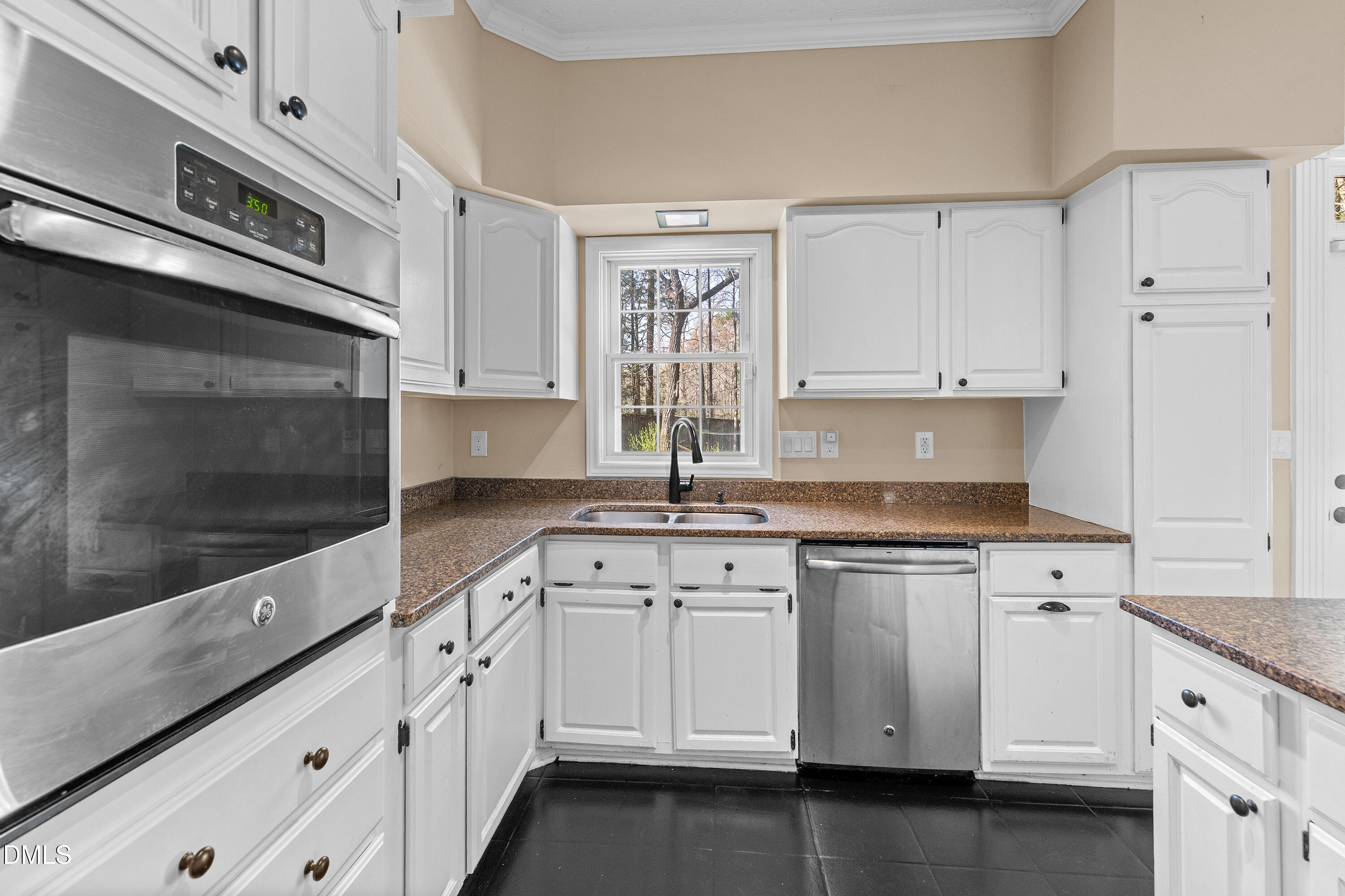 340 Andrews Store Road Pittsboro, NC 27312 - Photo 20 of 59 a kitchen with granite countertop white cabinets and white stainless steel appliances