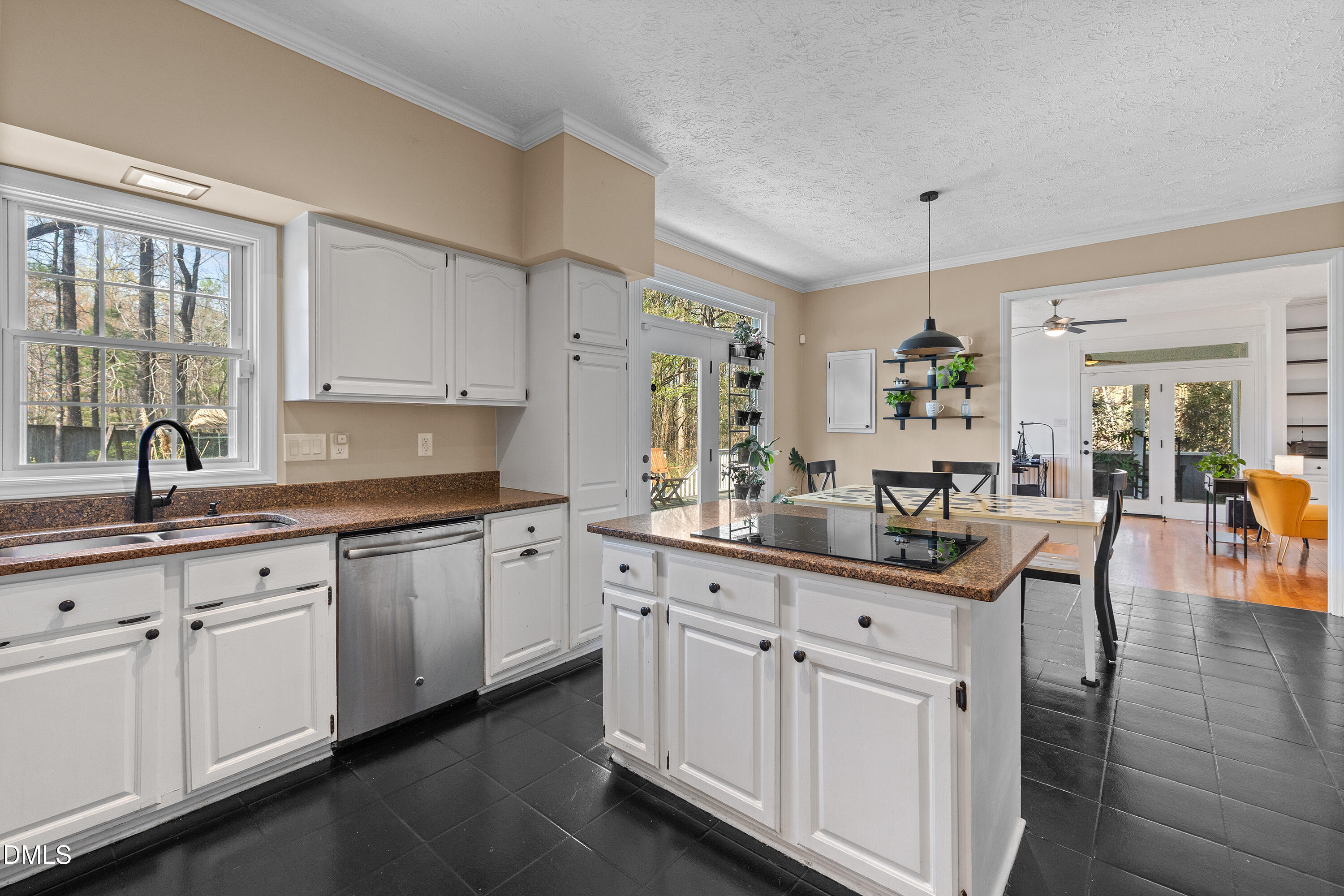 340 Andrews Store Road Pittsboro, NC 27312 - Photo 21 of 59 a kitchen with white cabinets and sink