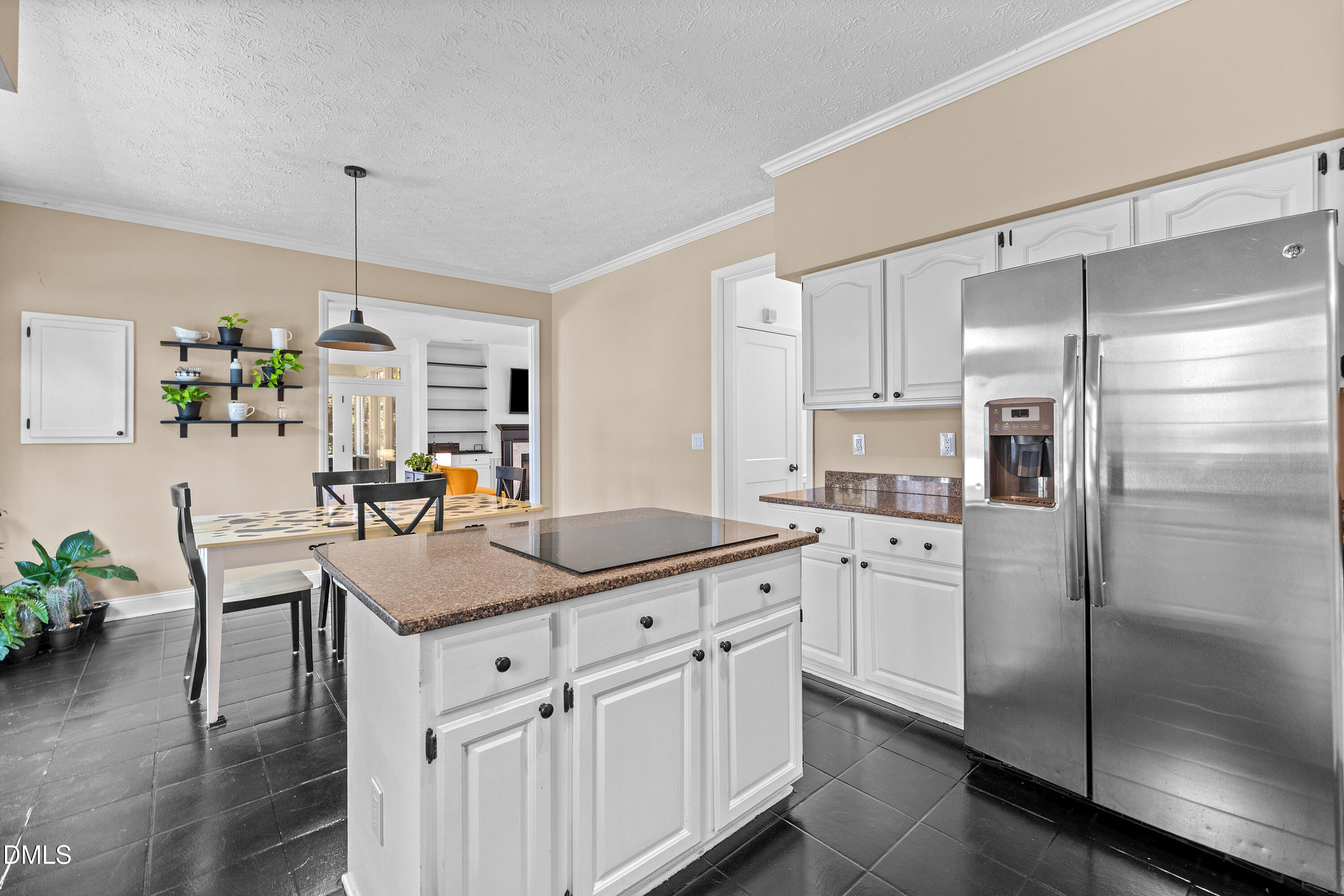 340 Andrews Store Road Pittsboro, NC 27312 - Photo 22 of 59 a kitchen with kitchen island granite countertop a sink cabinets and stainless steel appliances