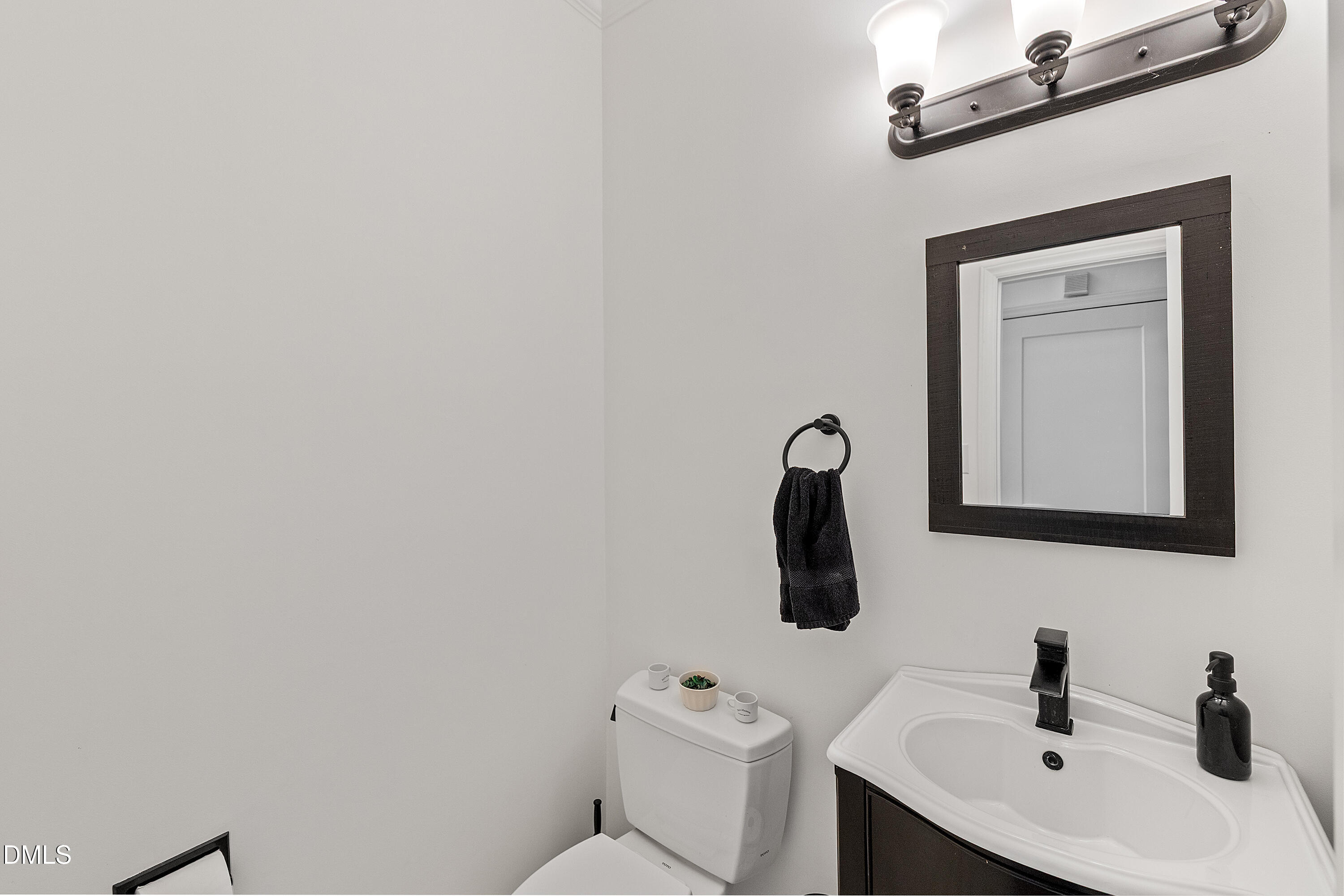 340 Andrews Store Road Pittsboro, NC 27312 - Photo 24 of 59 a bathroom with a toilet sink and mirror