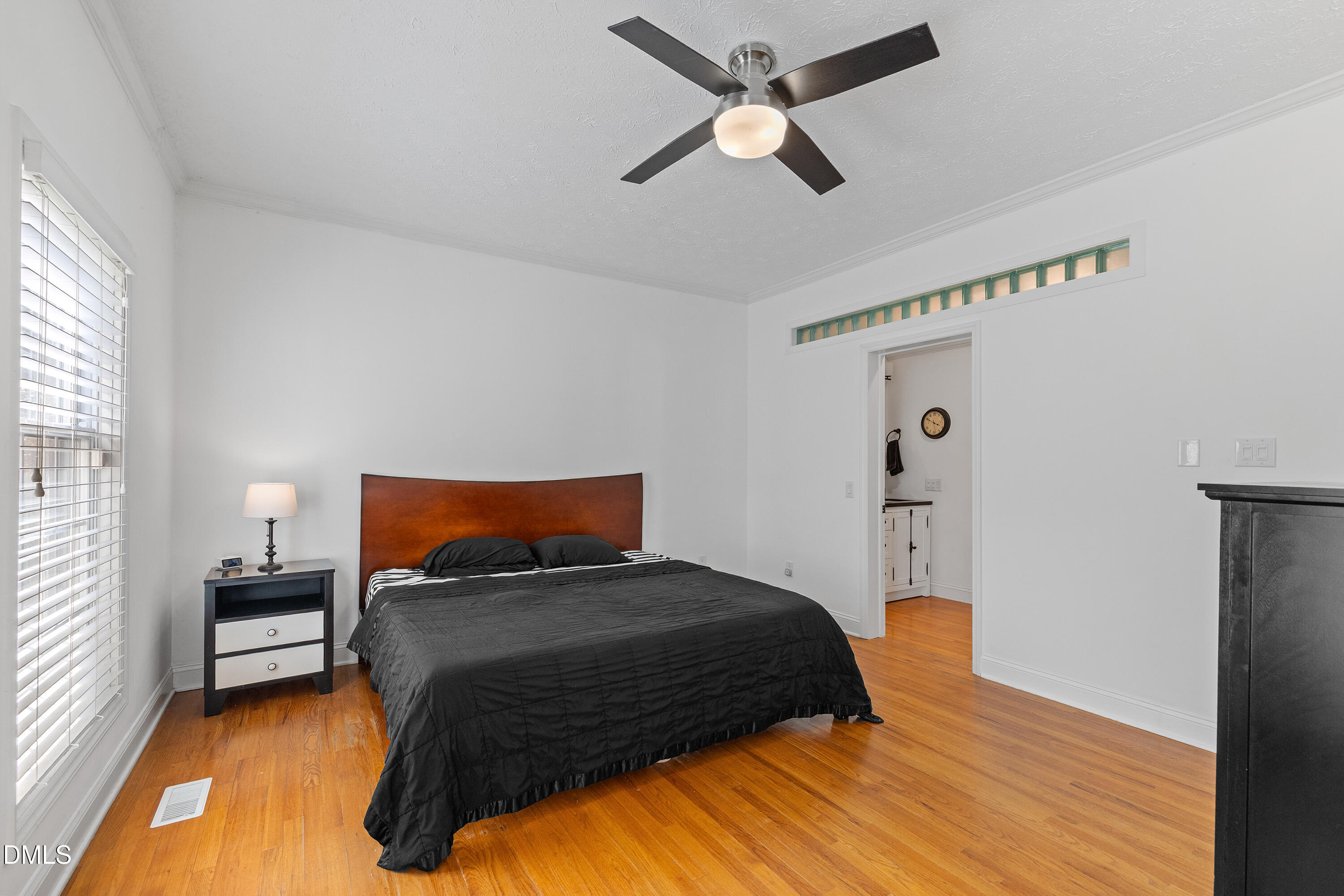 340 Andrews Store Road Pittsboro, NC 27312 - Photo 25 of 59 a bedroom with a bed window and a ceiling fan