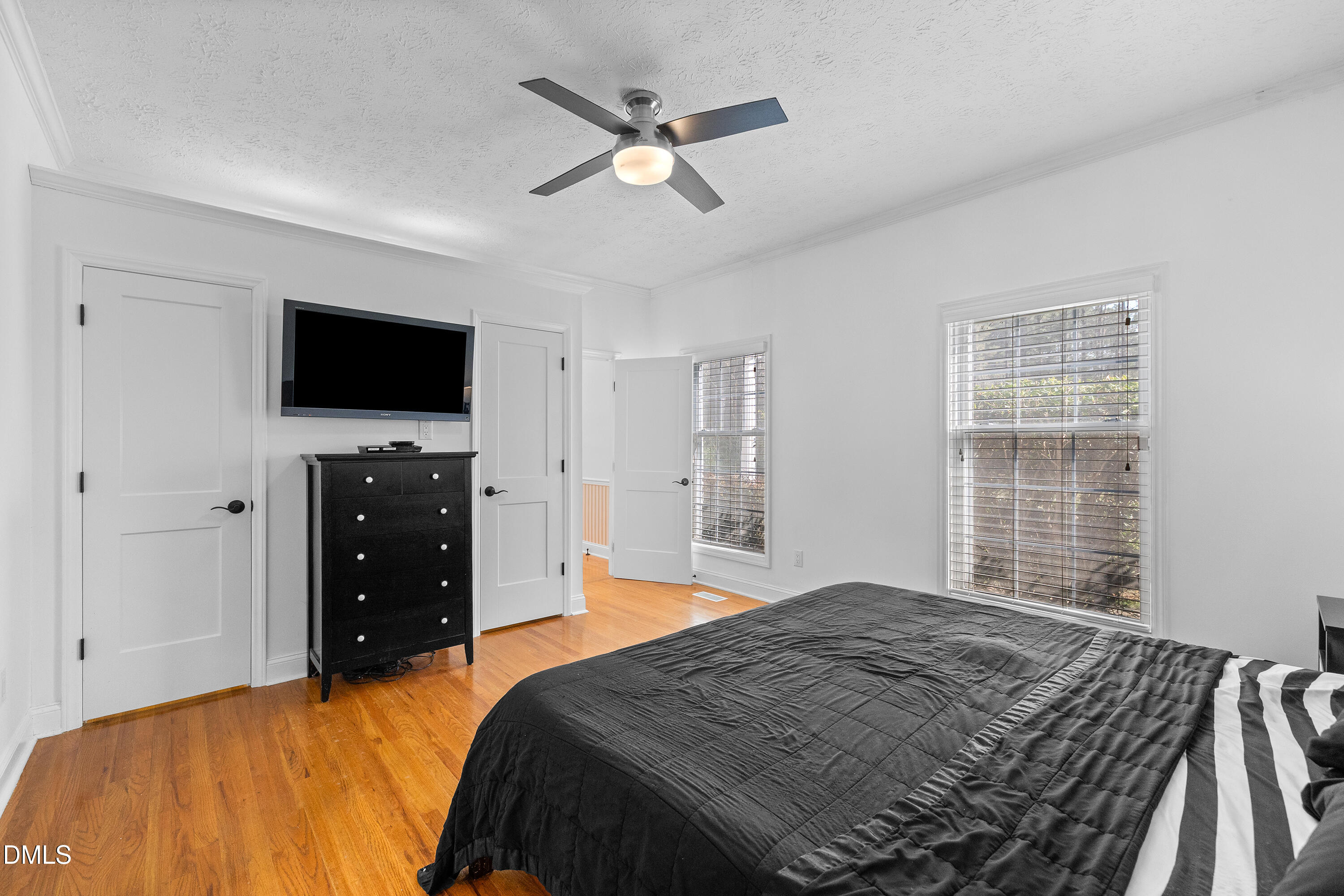 340 Andrews Store Road Pittsboro, NC 27312 - Photo 27 of 59 a bedroom with a bed and a flat screen tv