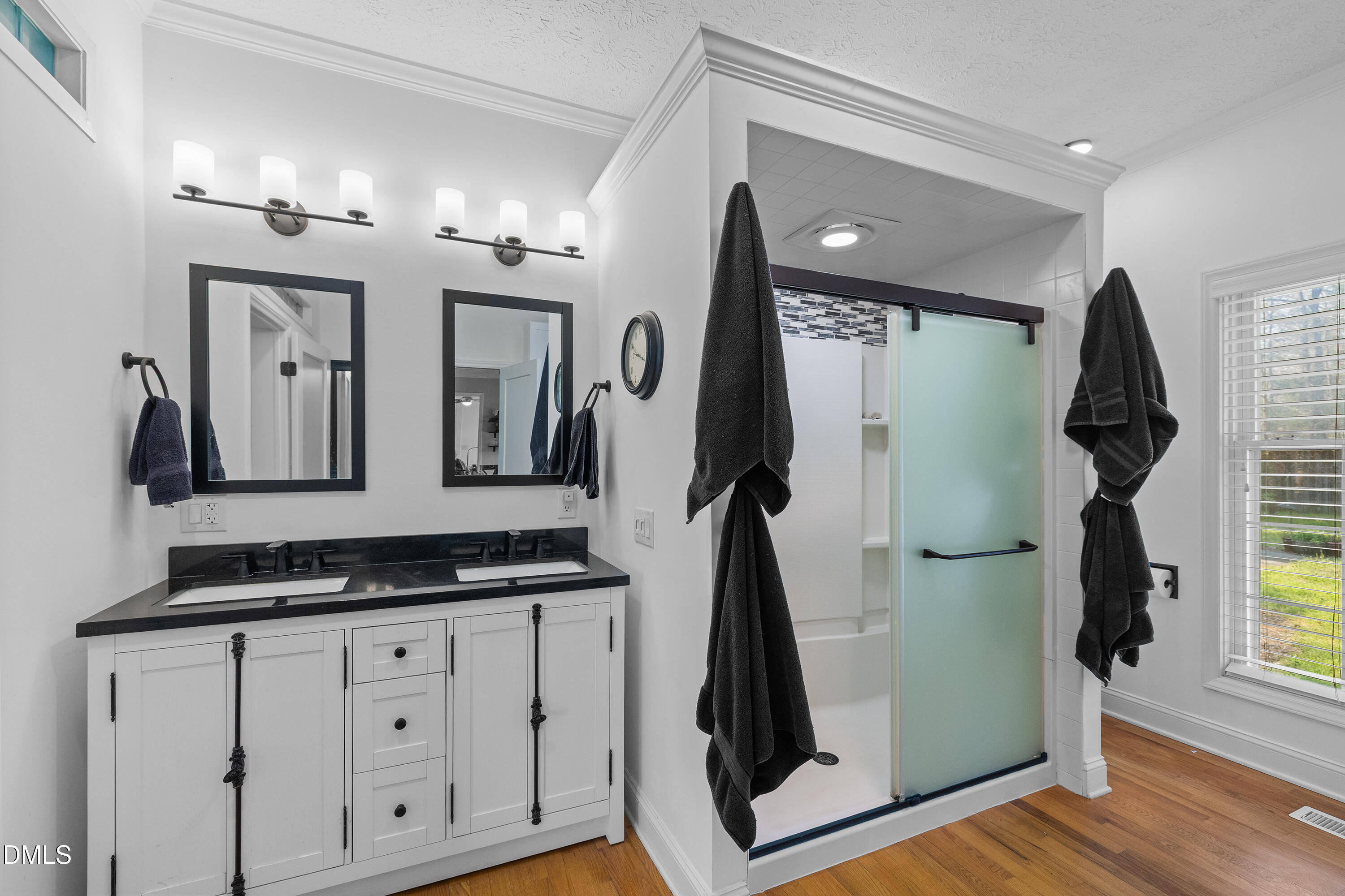 340 Andrews Store Road Pittsboro, NC 27312 - Photo 28 of 59 a bathroom with double vanity and a mirror