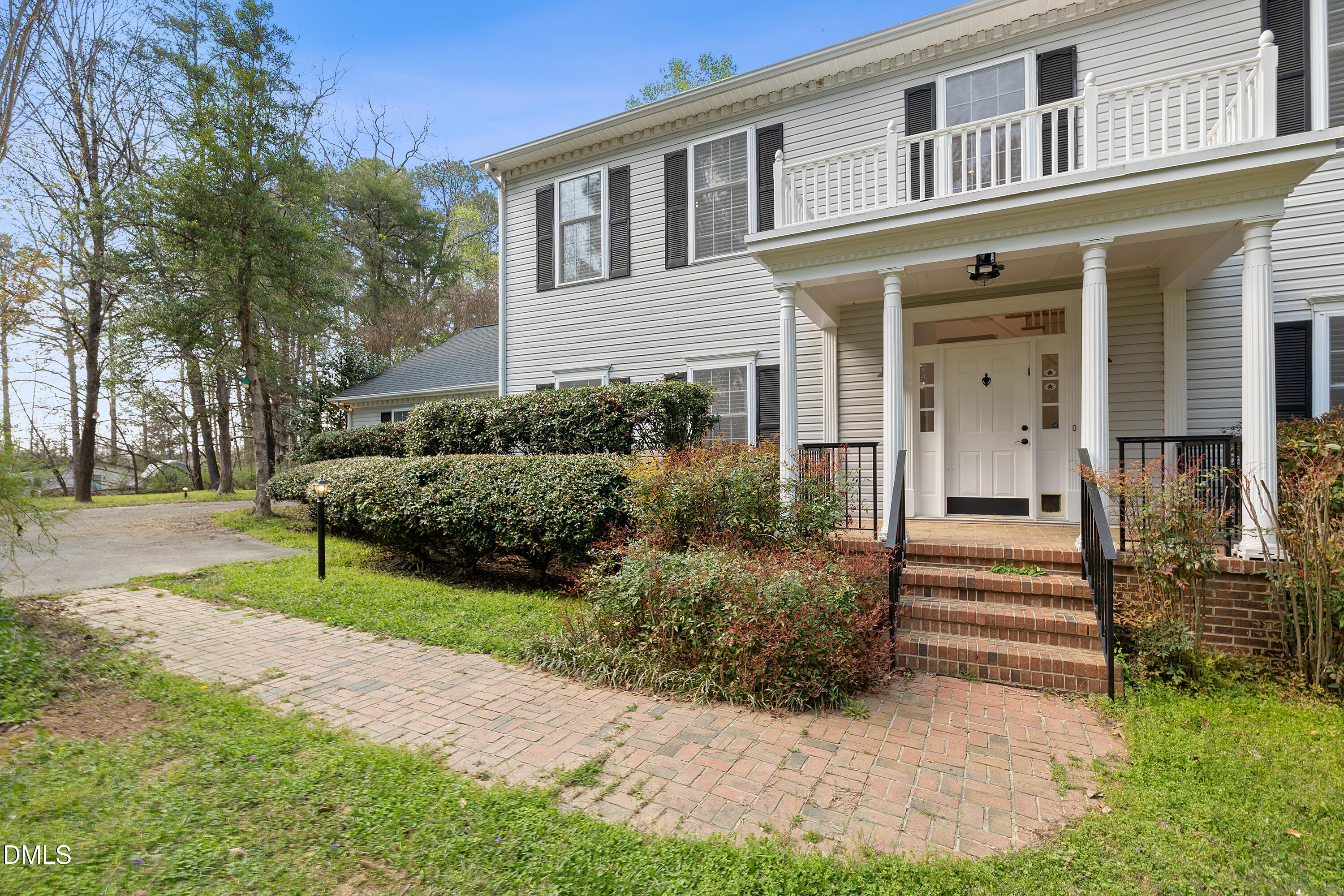 340 Andrews Store Road Pittsboro, NC 27312 - Photo 3 of 59 a front view of a house with garden