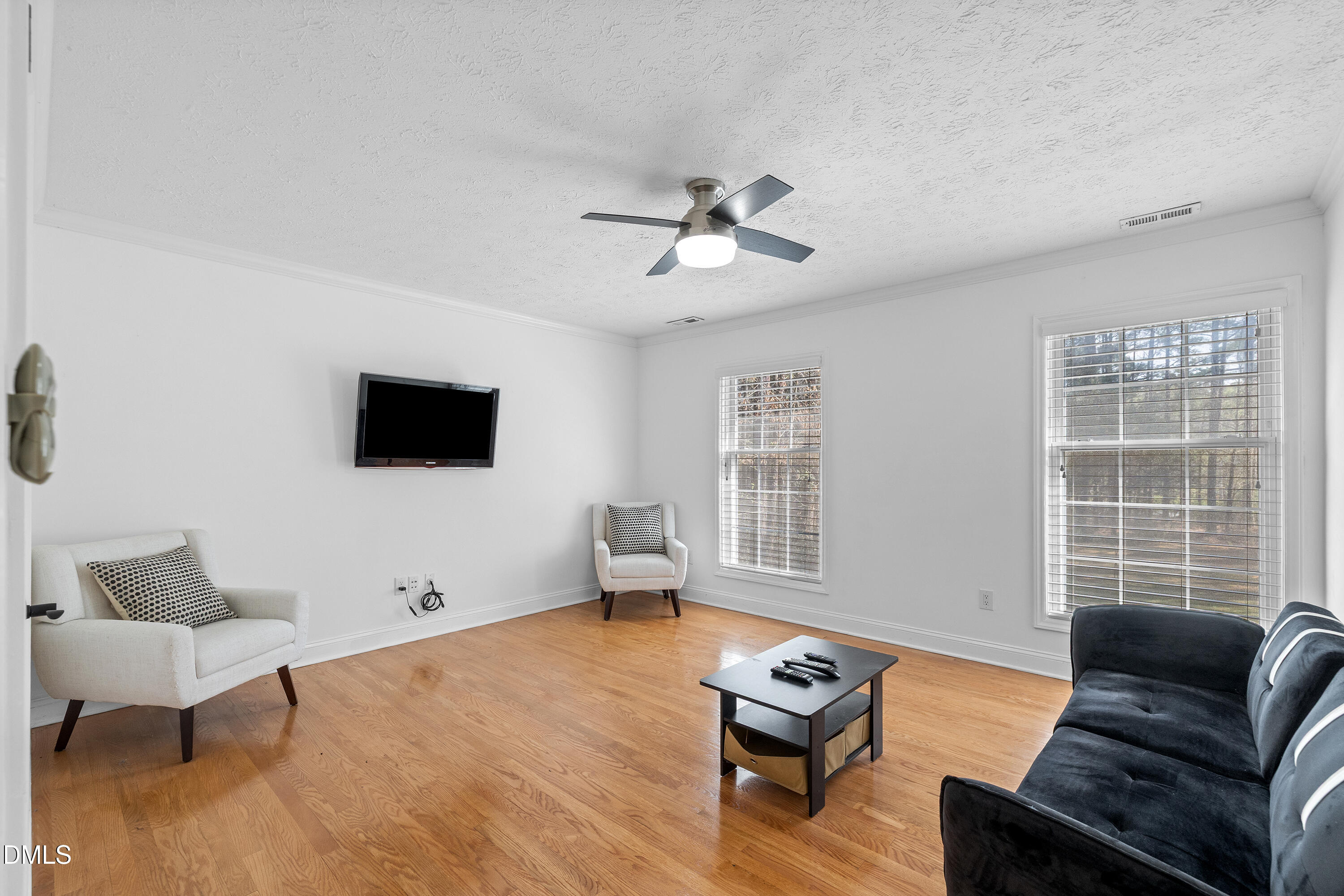 340 Andrews Store Road Pittsboro, NC 27312 - Photo 39 of 59 a living room with furniture and a flat screen tv