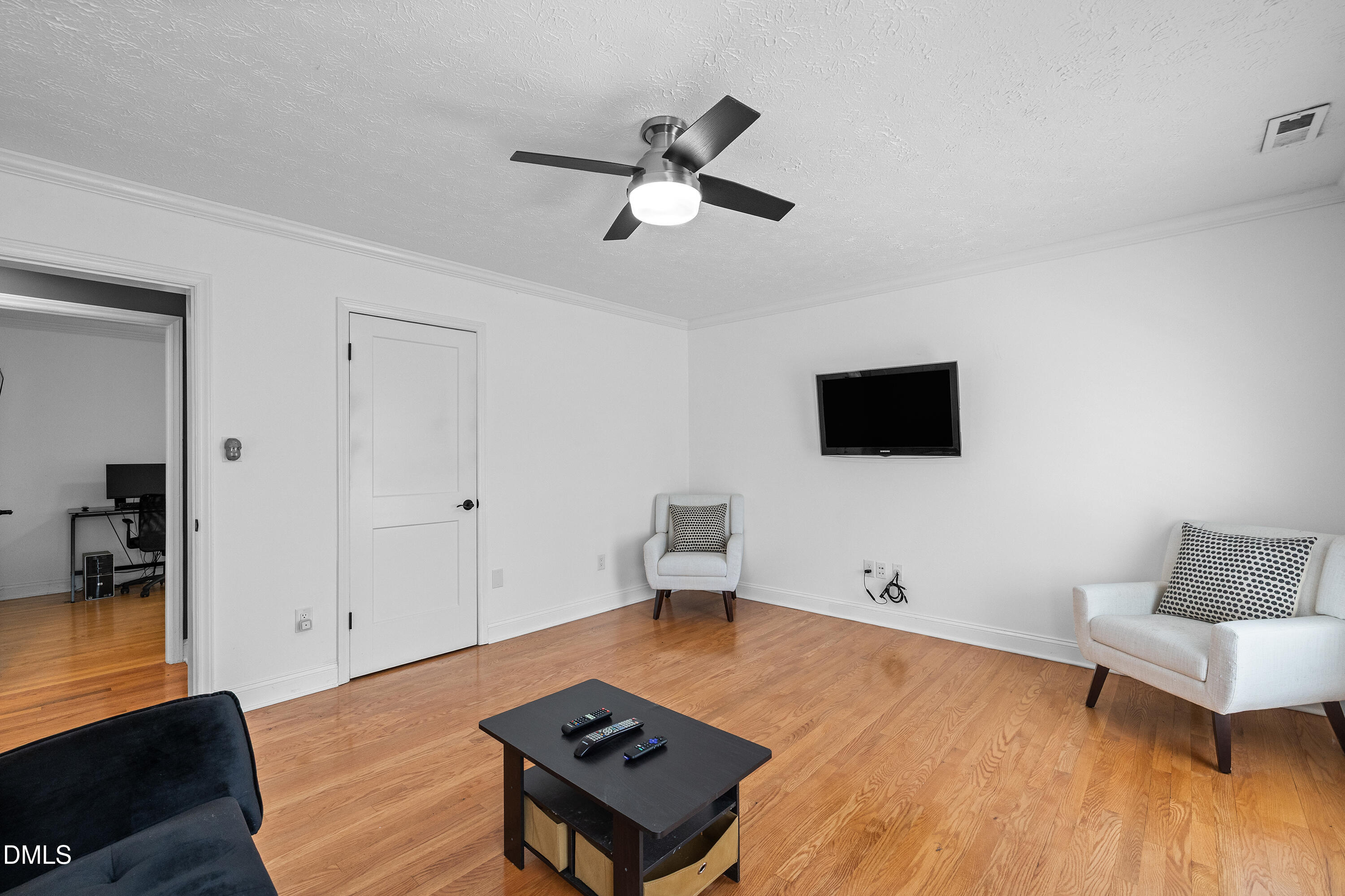 340 Andrews Store Road Pittsboro, NC 27312 - Photo 40 of 59 a living room with furniture and a flat screen tv