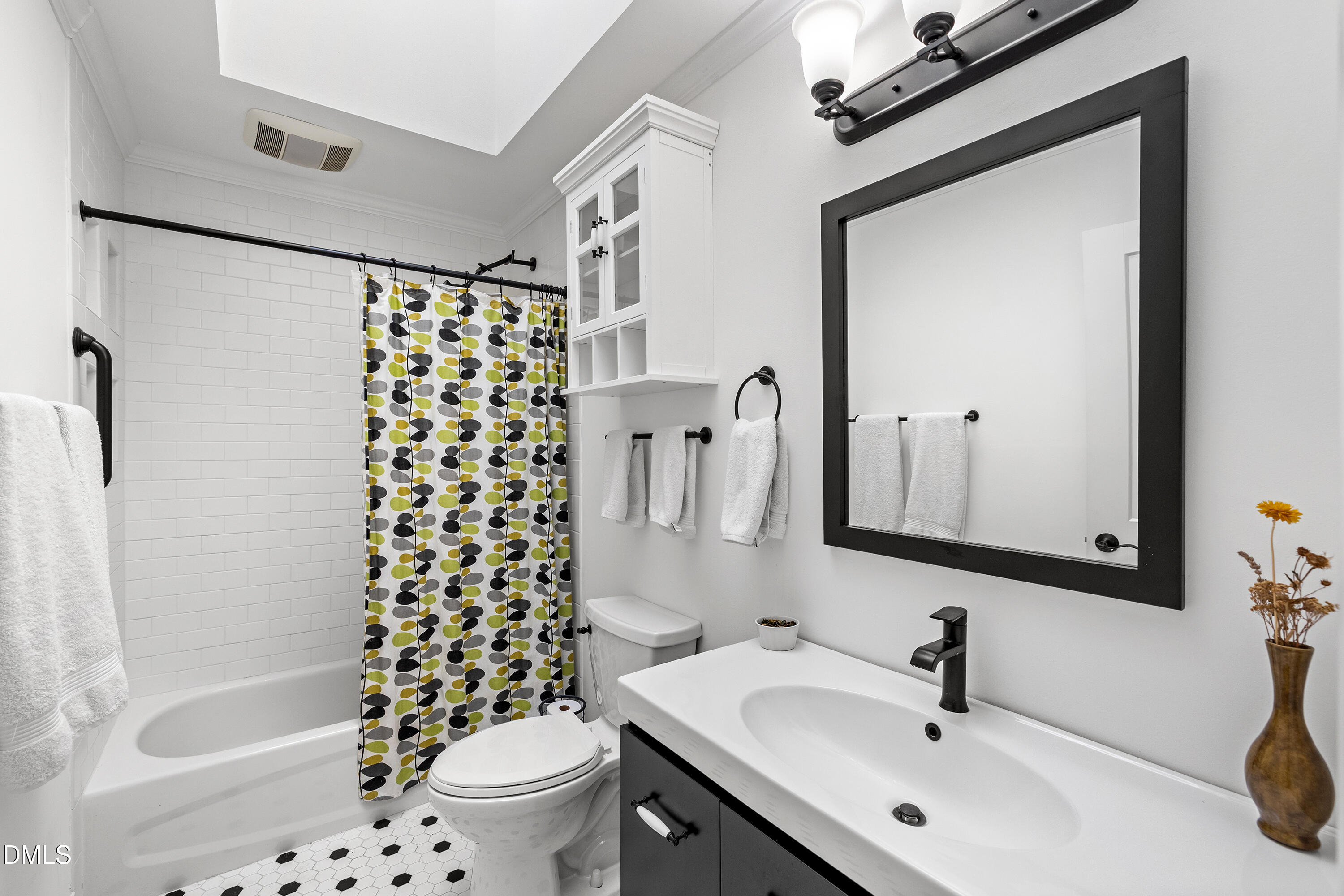 340 Andrews Store Road Pittsboro, NC 27312 - Photo 43 of 59 a bathroom with a sink a toilet and shower curtain