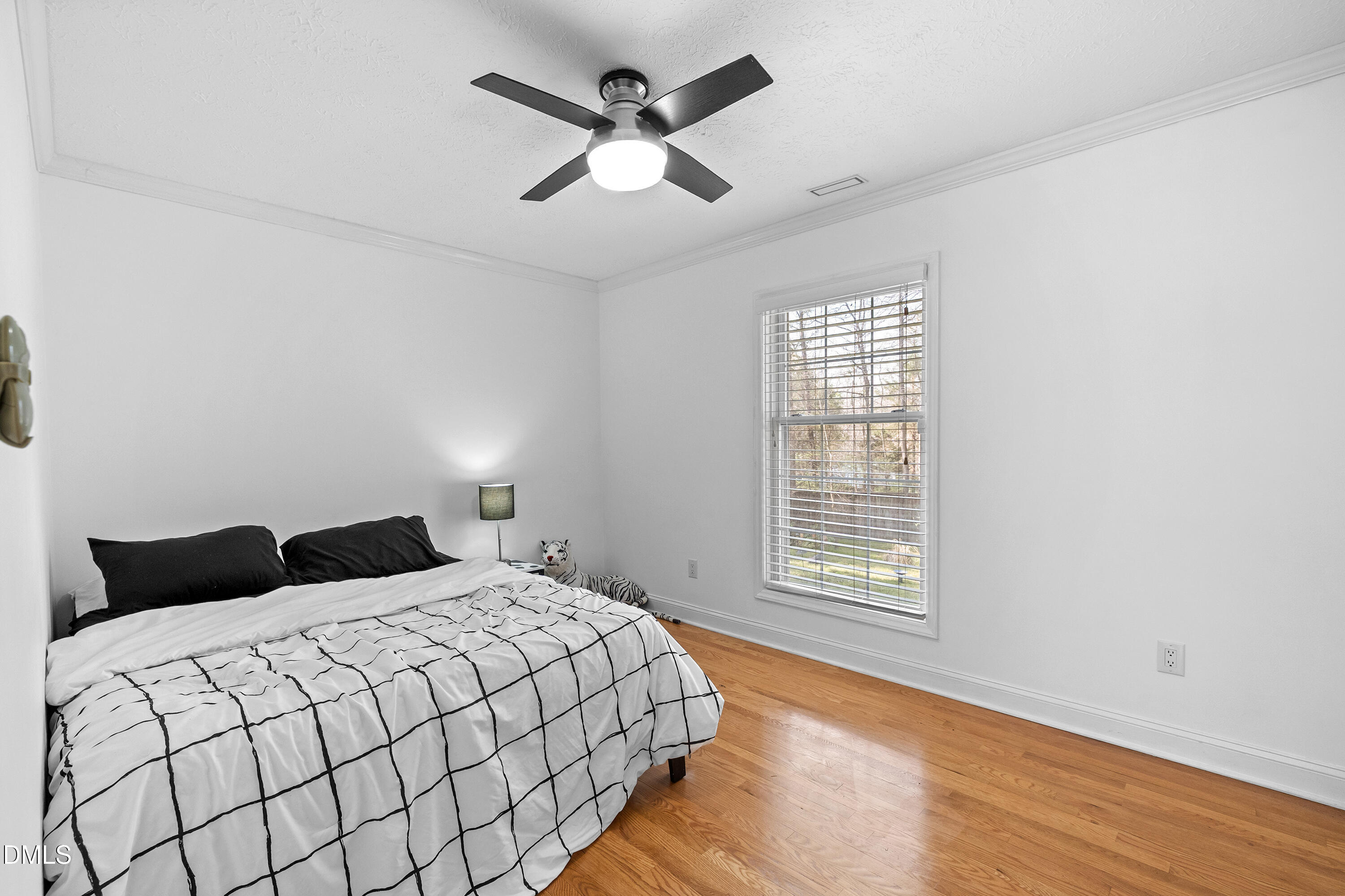 340 Andrews Store Road Pittsboro, NC 27312 - Photo 44 of 59 a bedroom with a large bed and a large window