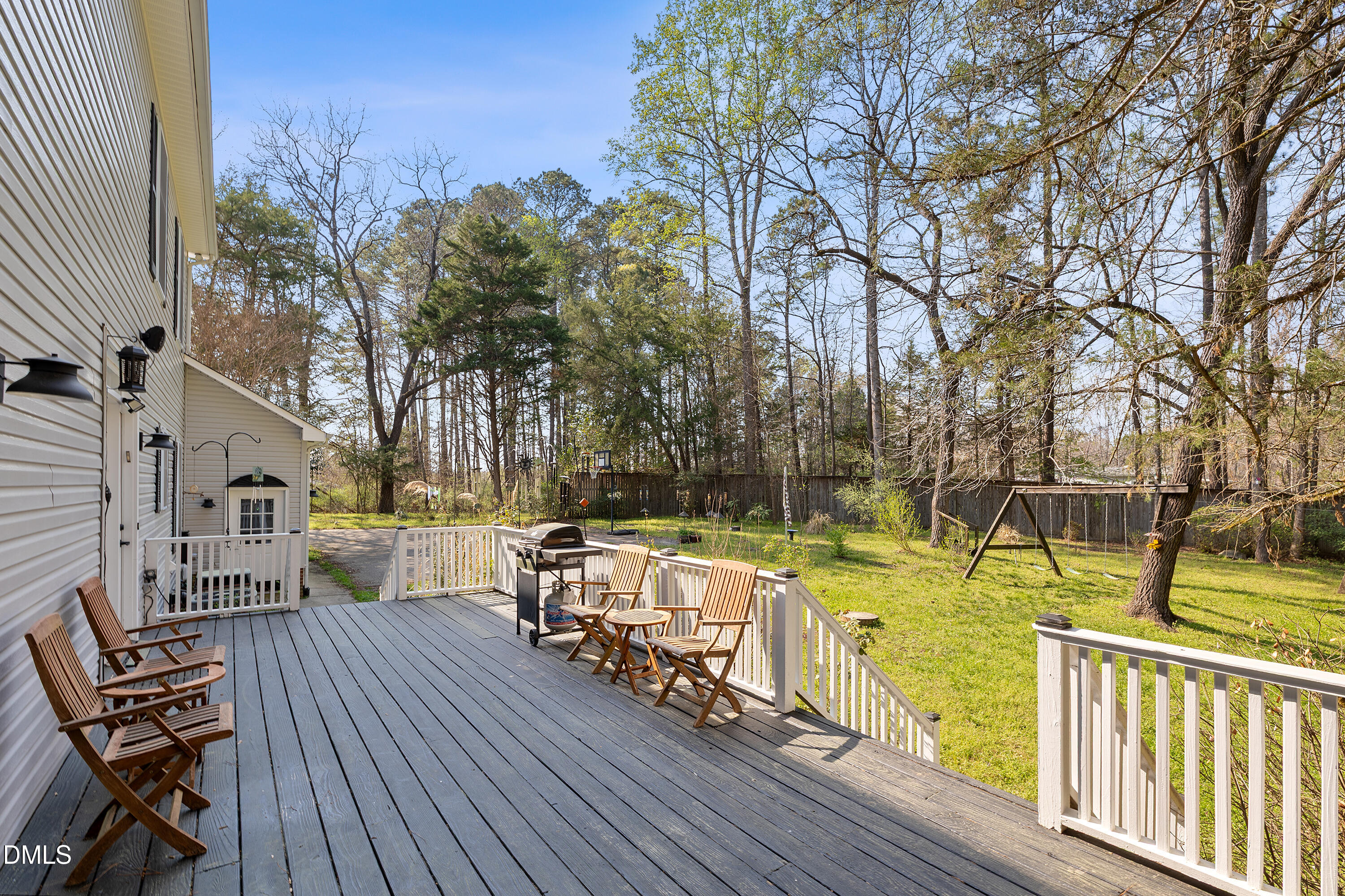 340 Andrews Store Road Pittsboro, NC 27312 - Photo 50 of 59 a view of a chair and tables on the wooden deck