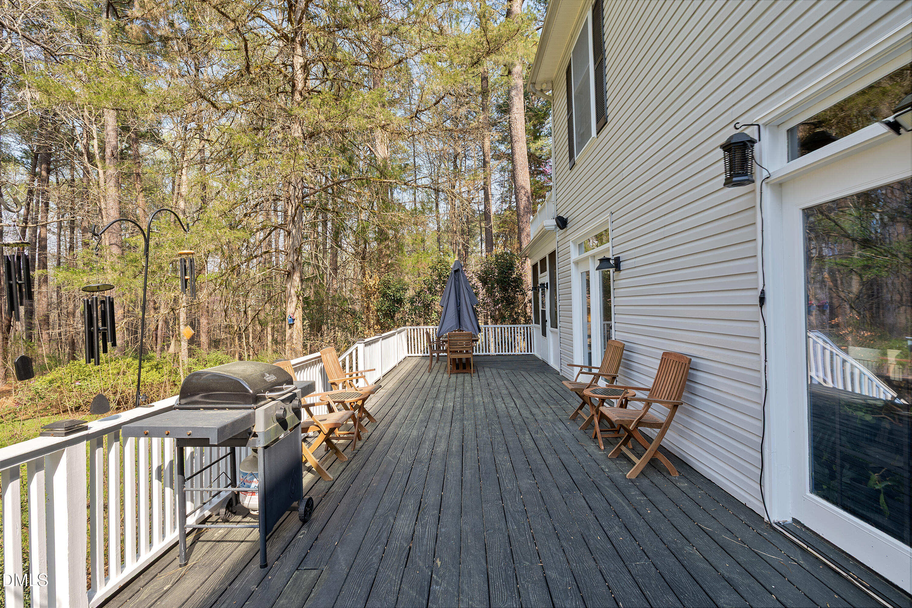 340 Andrews Store Road Pittsboro, NC 27312 - Photo 51 of 59 a view of a roof deck with table and chairs and wooden floor