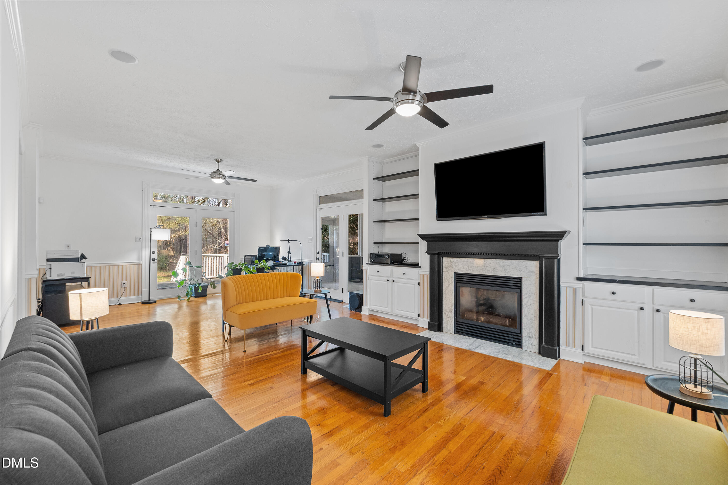 340 Andrews Store Road Pittsboro, NC 27312 - Photo 8 of 59 a living room with furniture a fireplace and a flat screen tv