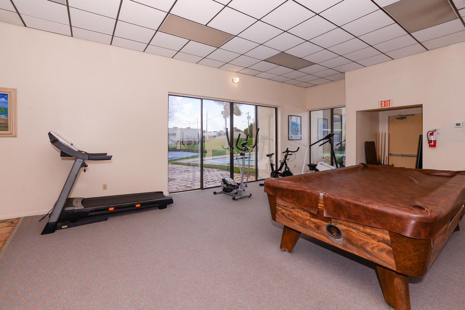 2050 Oleander Boulevard, Unit 2202 Fort Pierce, FL 34950 - Photo 12 of 15 a bed room with a bed and a chair