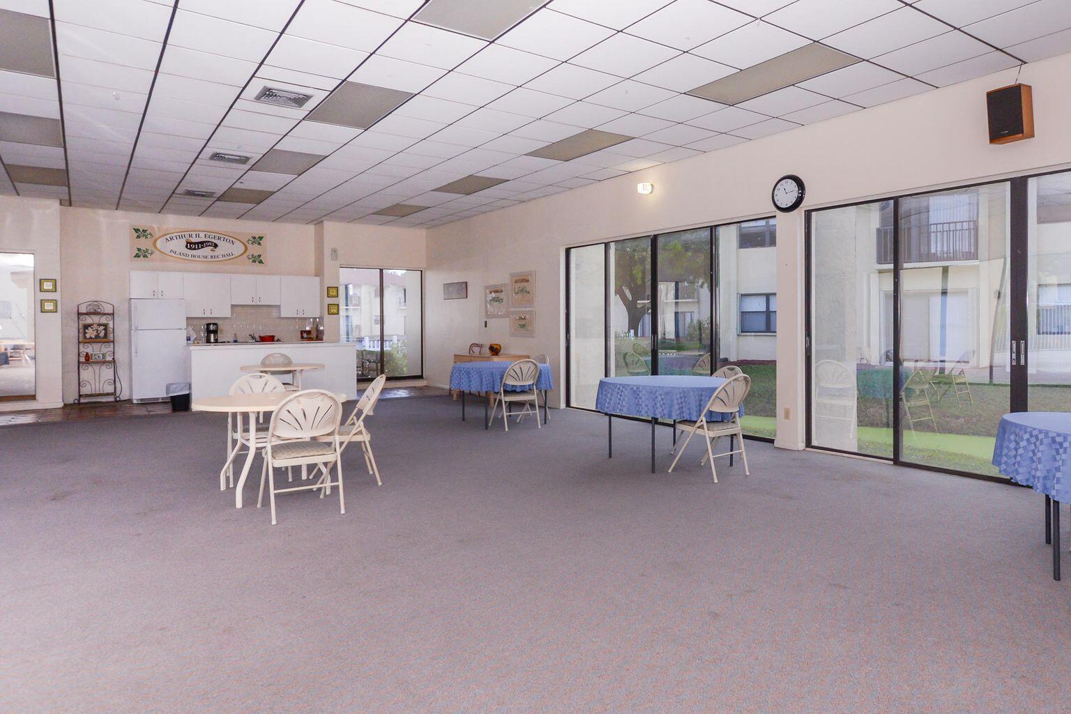 2050 Oleander Boulevard, Unit 2202 Fort Pierce, FL 34950 - Photo 13 of 15 a living room with furniture and a chandelier