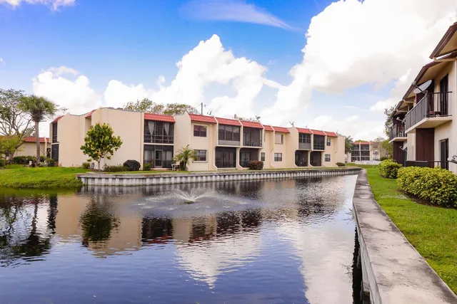 a view of a lake with a building next to a lake