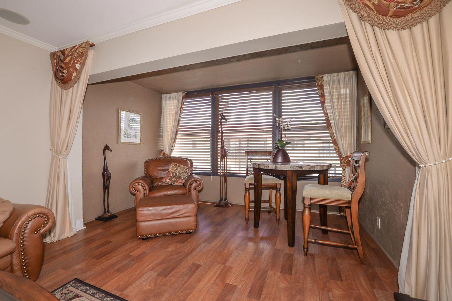2050 Oleander Boulevard, Unit 2202 Fort Pierce, FL 34950 - Photo 2 of 15 a living room with furniture and a wooden floor