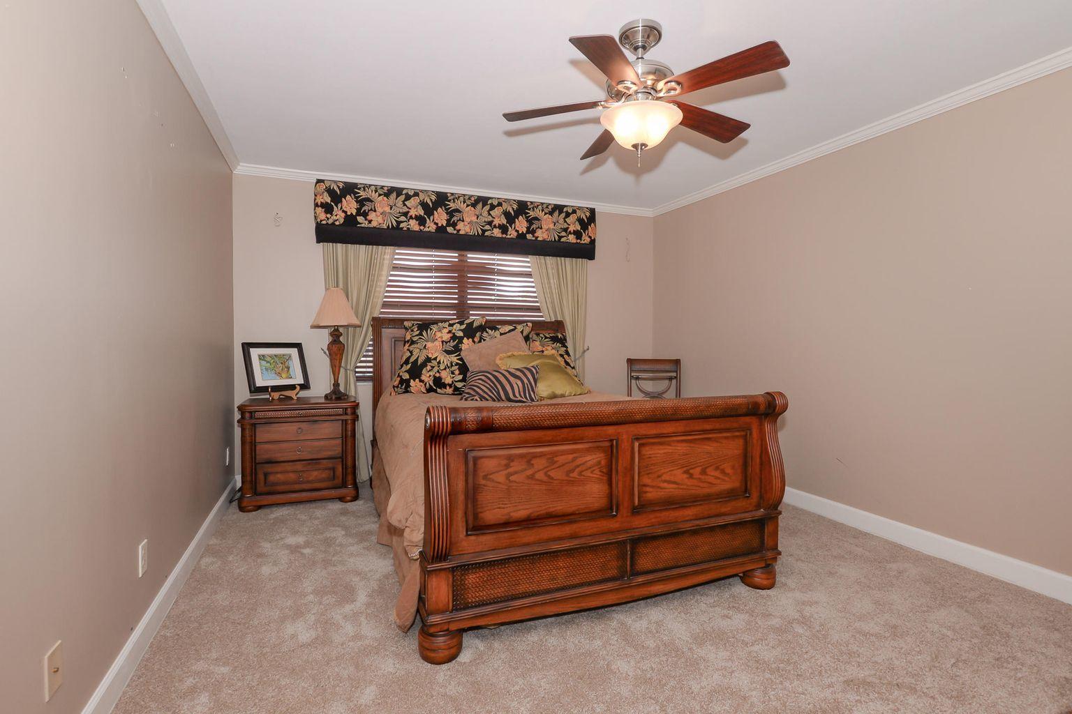 2050 Oleander Boulevard, Unit 2202 Fort Pierce, FL 34950 - Photo 6 of 15 a bed room with furniture and a window
