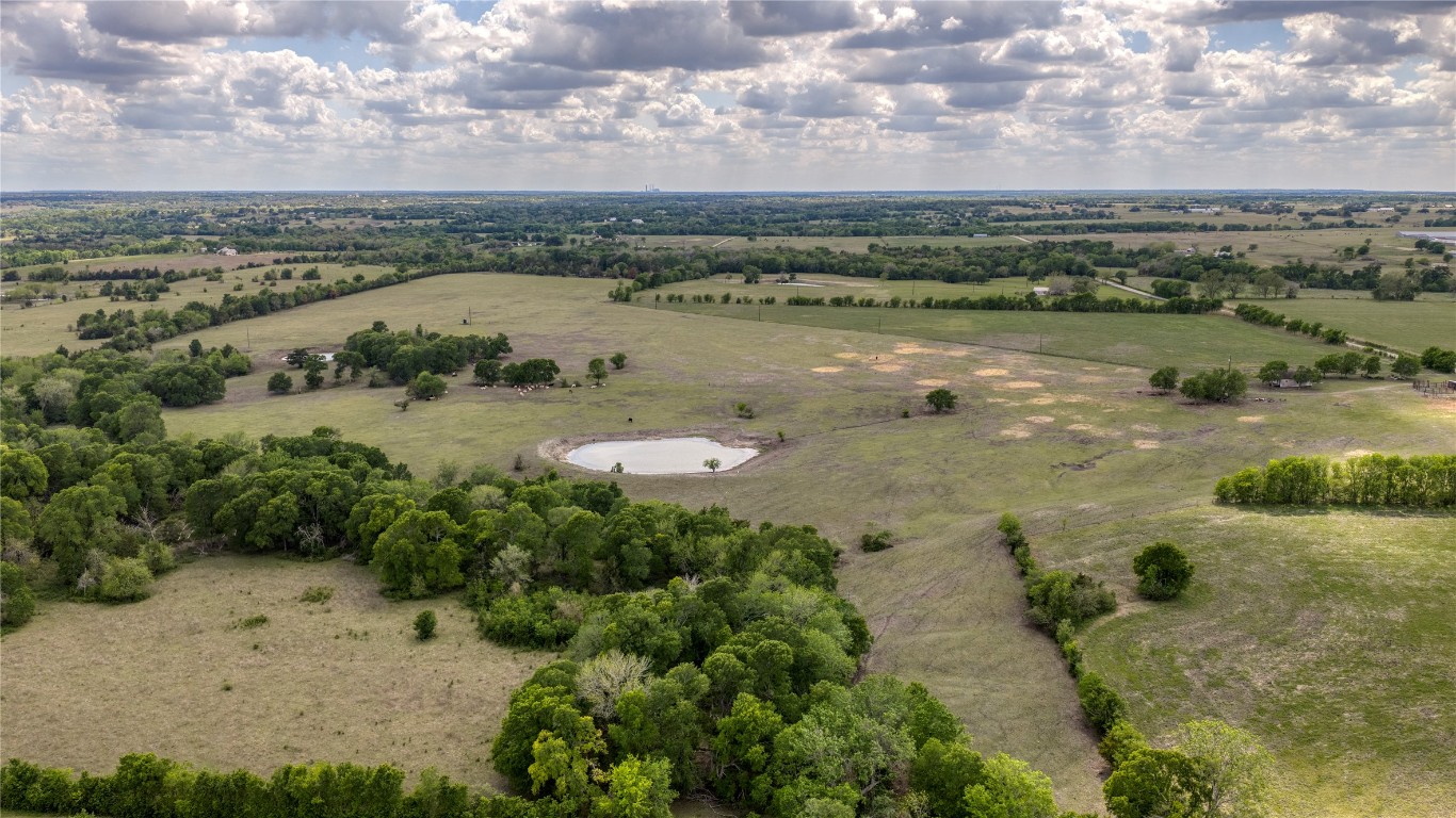 6807 Winedale Road Burton, TX 77835 - Photo 12 of 24 a view of a lake with mountains in the background