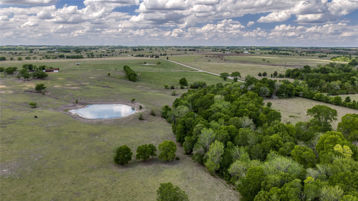 6807 Winedale Road Burton, TX 77835 - Photo 3 of 24 a view of a lake with a mountain