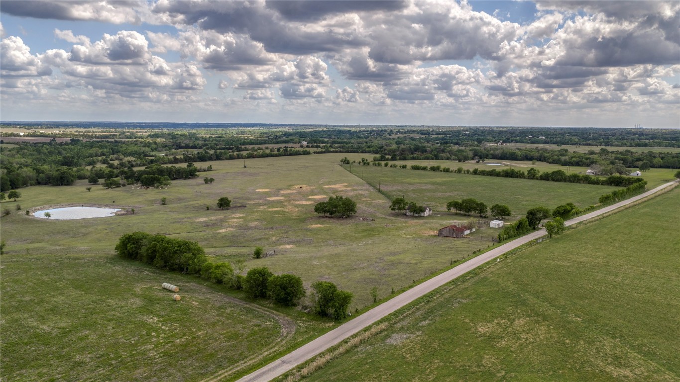 6807 Winedale Road Burton, TX 77835 - Photo 6 of 24 a view of a lake with a yard