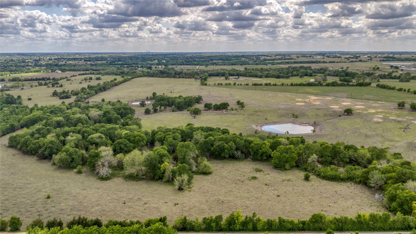 6807 Winedale Road Burton, TX 77835 - Photo 9 of 24 a view of a lake with houses in the back
