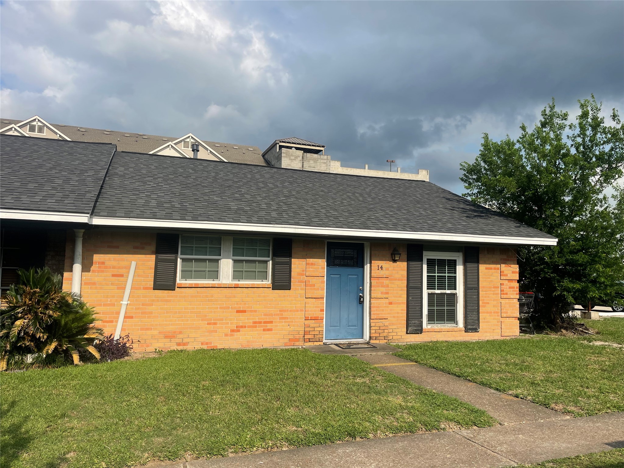 9775 Pine Lake Drive, Unit 14 Houston, TX 77055 - Photo 6 of 6 a front view of a house with a yard