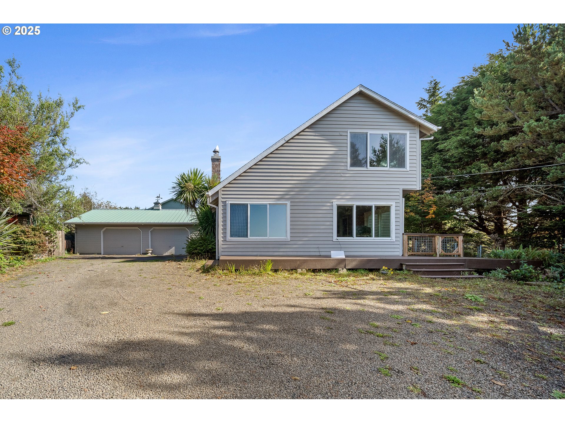 4900 Clam Way Tillamook, OR 97141 - Photo 1 of 30 a front view of a house with a yard