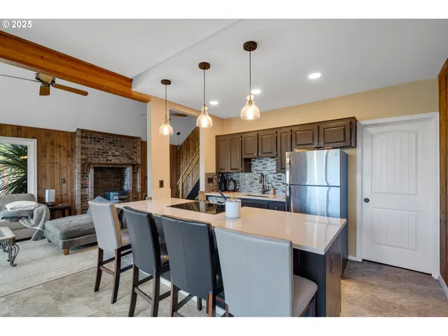 a kitchen with a sink cabinets and appliances