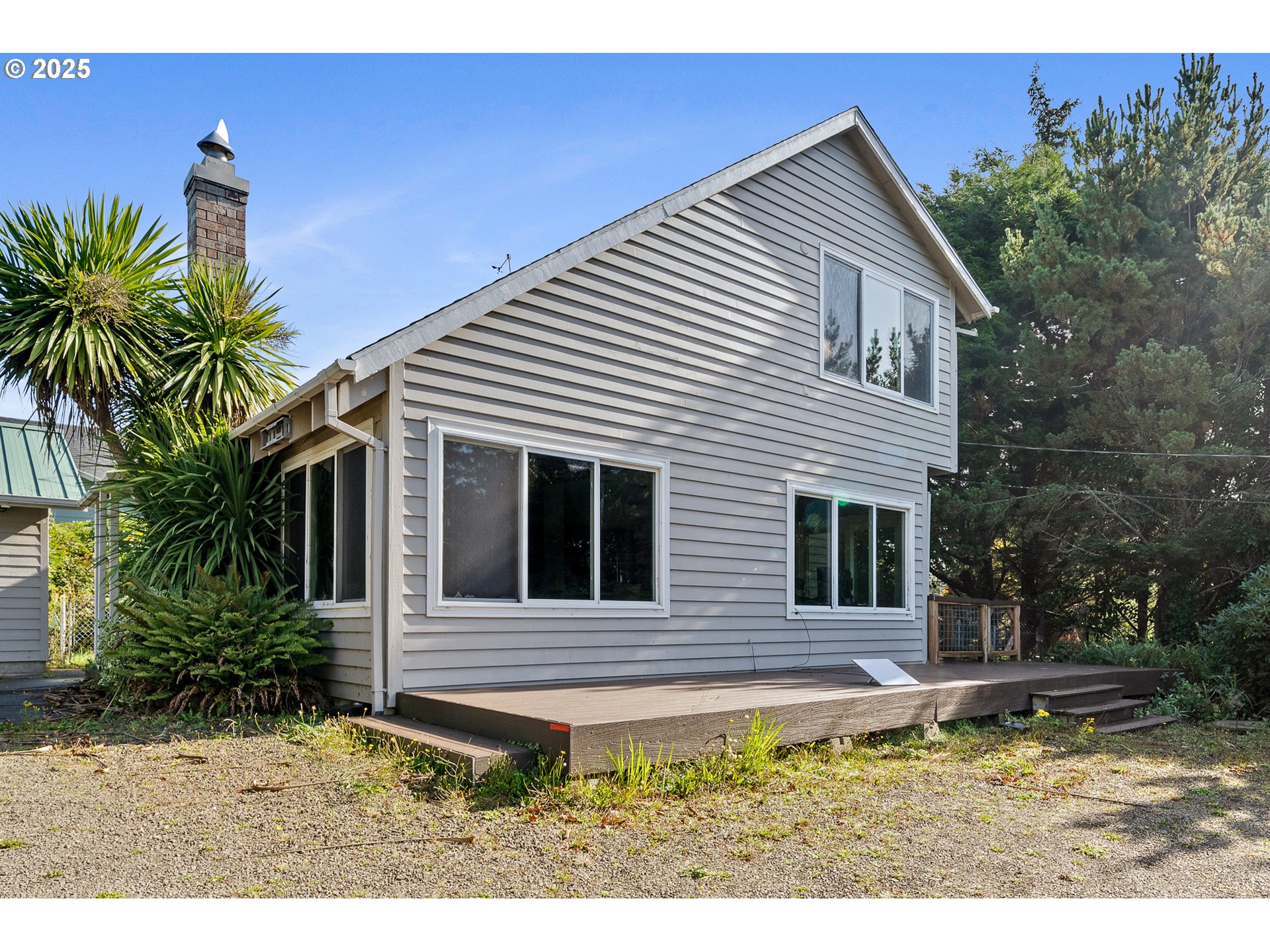 4900 Clam Way Tillamook, OR 97141 - Photo 2 of 30 a view of a house with a yard
