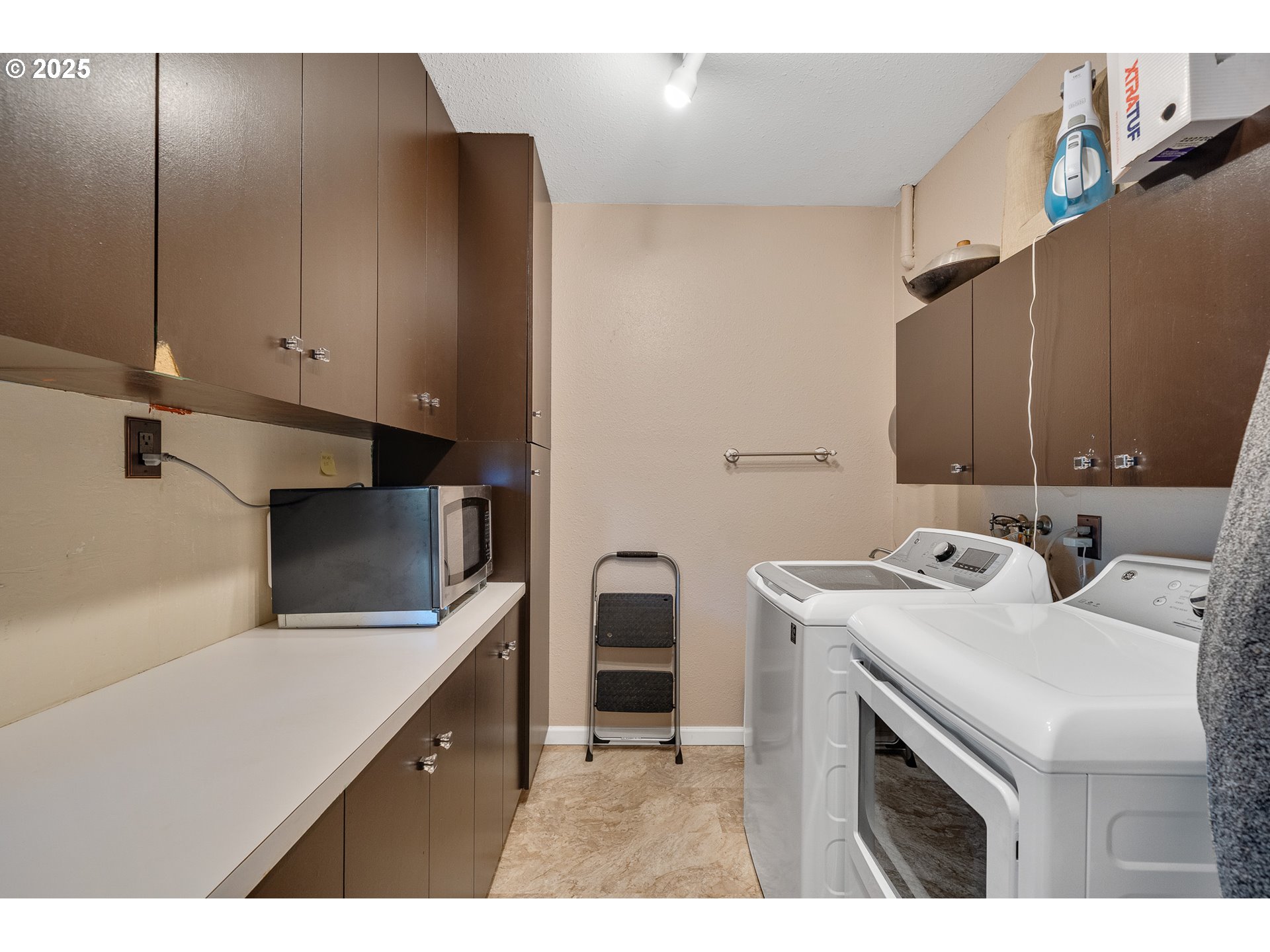 4900 Clam Way Tillamook, OR 97141 - Photo 21 of 30 a kitchen with a sink cabinets and appliances