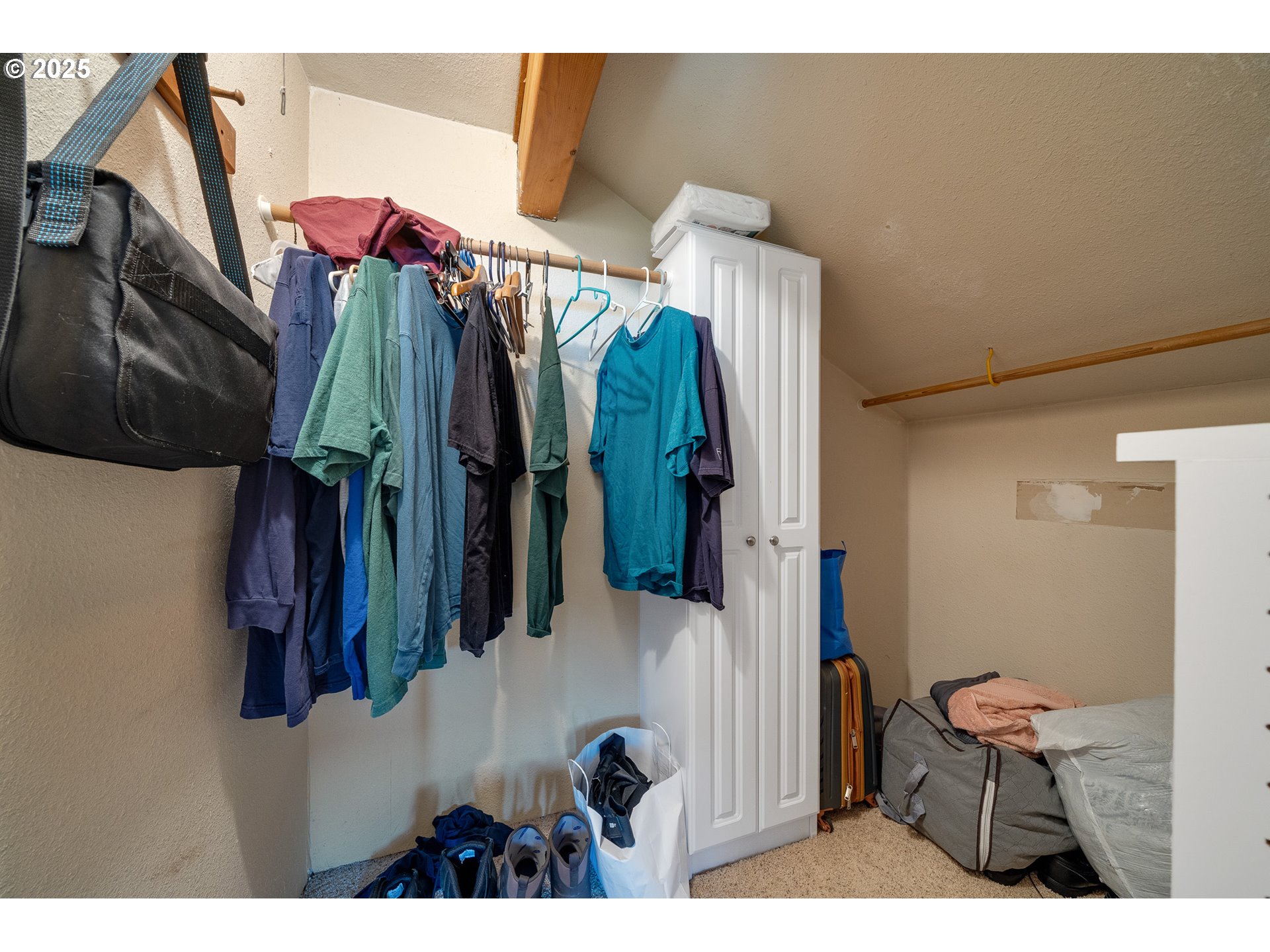 4900 Clam Way Tillamook, OR 97141 - Photo 25 of 30 a view of walk in closet with clothes and shoes