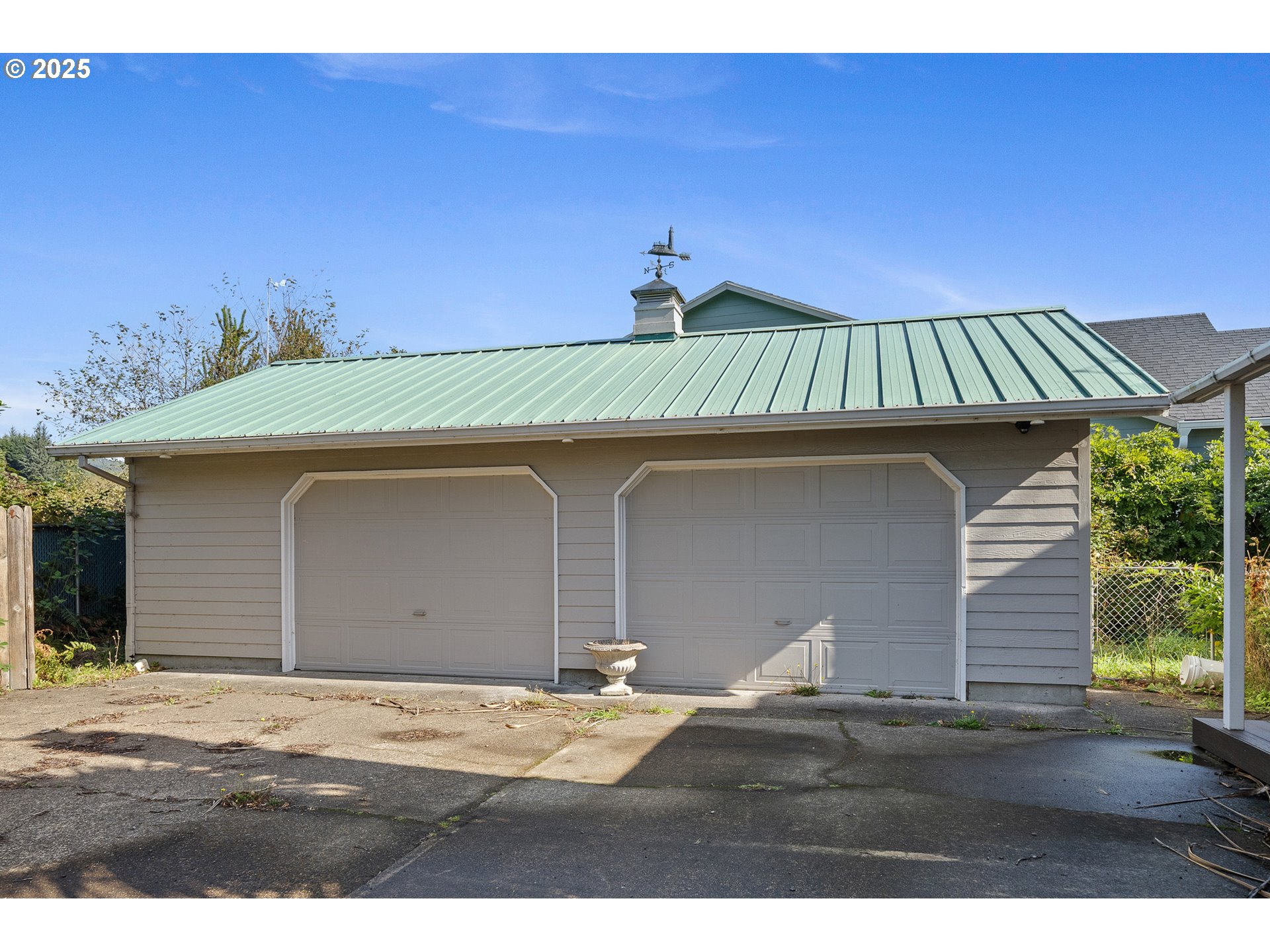 4900 Clam Way Tillamook, OR 97141 - Photo 4 of 30 a front view of a house with a garage