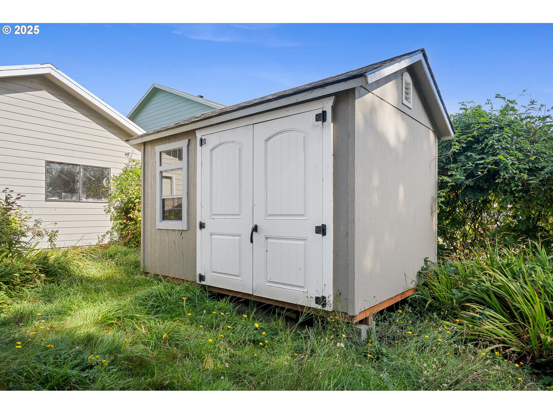 4900 Clam Way Tillamook, OR 97141 - Photo 8 of 30 a house view with a backyard space